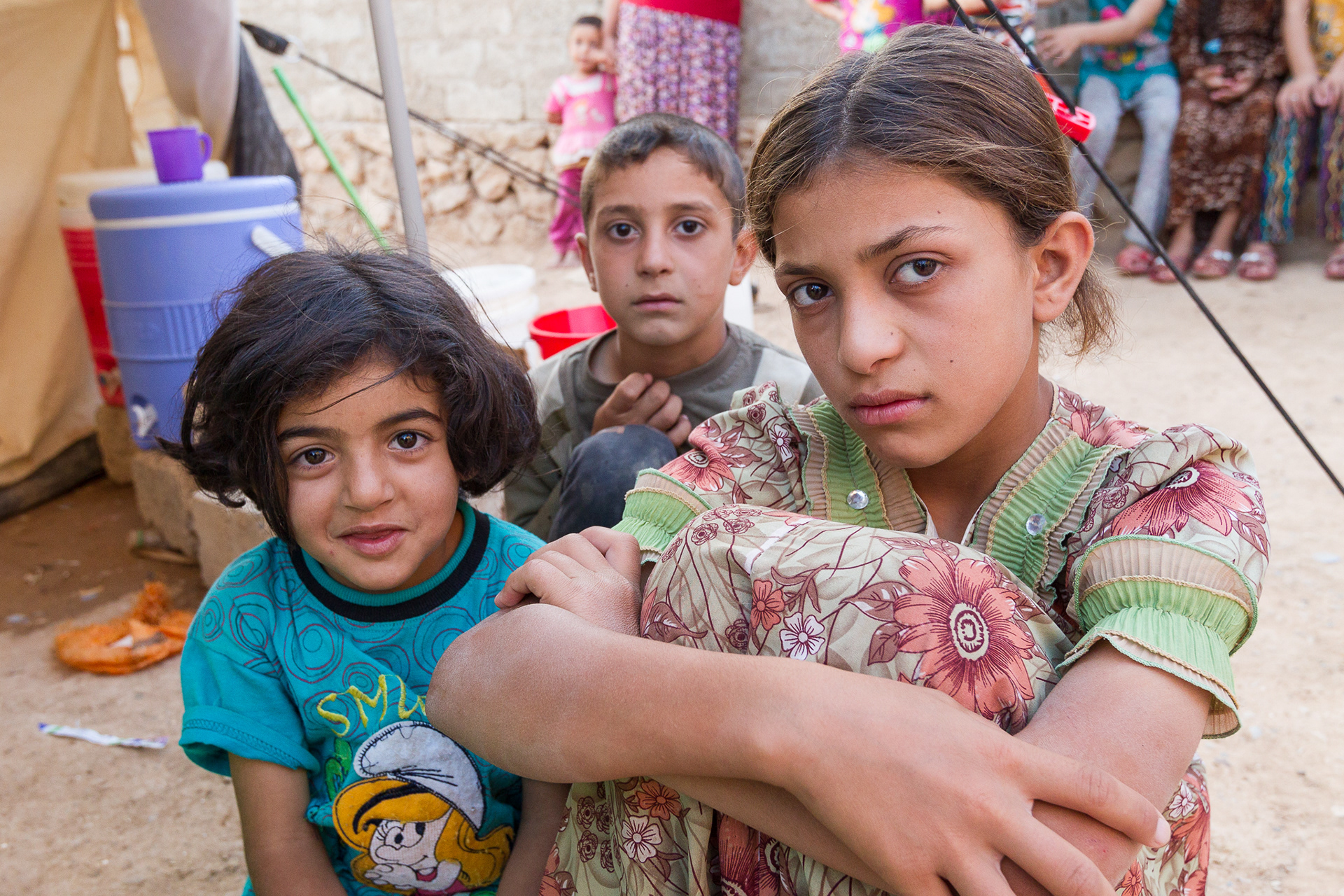 Yazidi children find refuge in a school playground, one of many internally displaced persons (IDP) camps, in Khanke, Iraq. Their father, Guly Badal Jerdo, a civil engineer by trade, shared his harrowing tale of escape from ISIS forces with delegates from the WCC and local aid organizations. The ISIS purge of religious minorities has swelled Khanke's population from 25,000 to 100,000. (Photo Gregg Brekke for WCC.