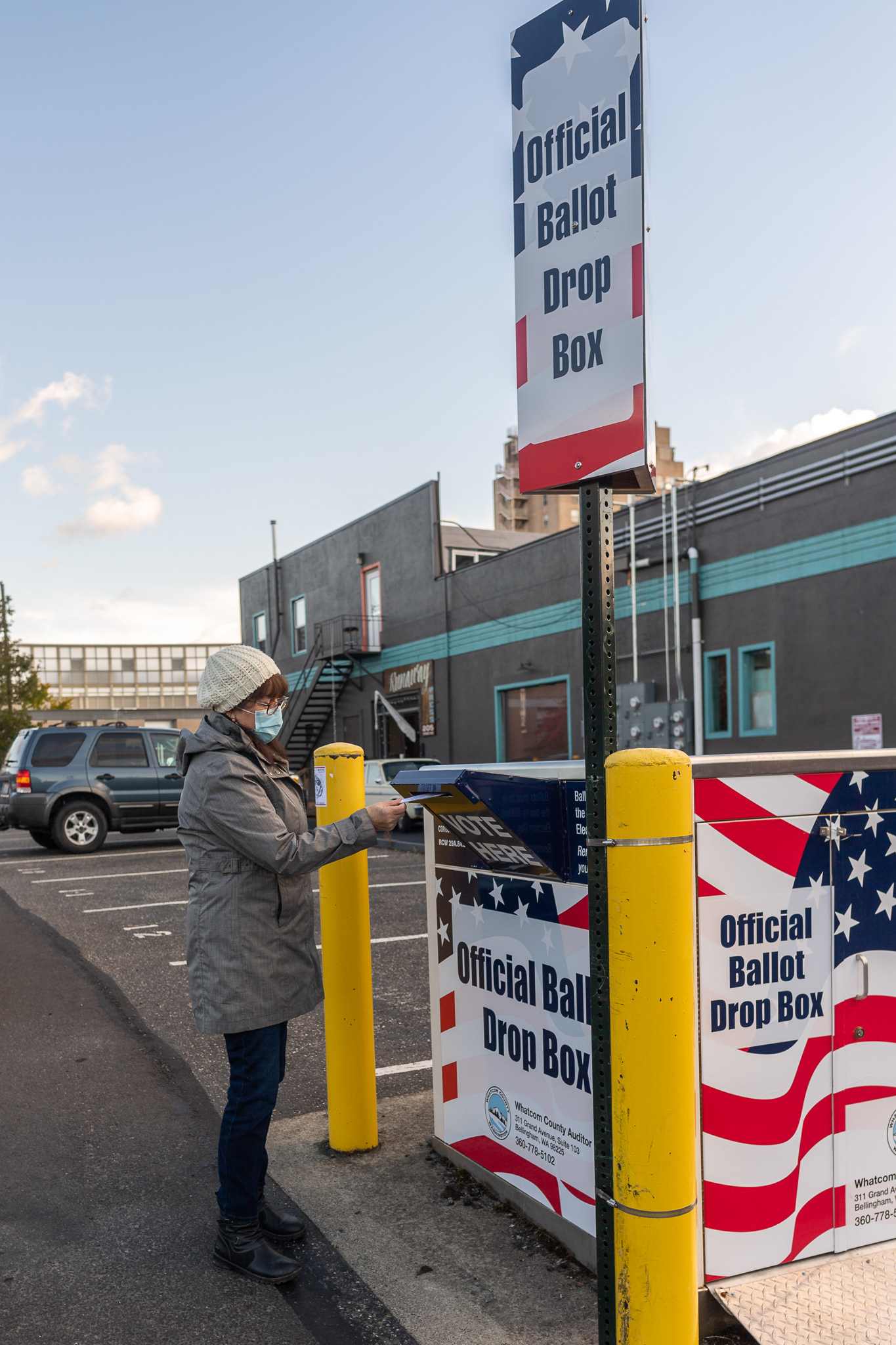 "I drove up [to Bellingham] to drop off my ballot - I don't trust the mail," says Elizabeth J. Jones of Alger, Wash., as she deposits her 2020 general election ballot in a dropbox near the Whatcom County Courthouse on October 21, 2020. Washington is one of a handful of states that votes exclusively by mail or ballot deposit box.