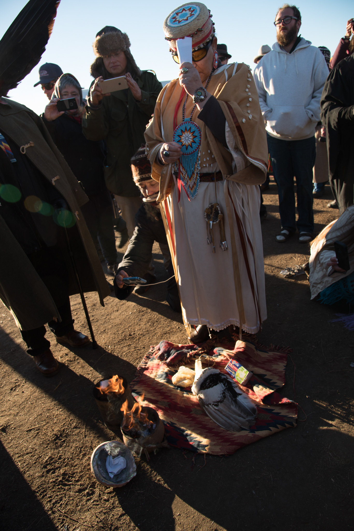 An elder burns copies of the Doctrine of Discovery at a Nov. 3 ceremony where faith leaders denounced the doctrine and apologized for its consequences.