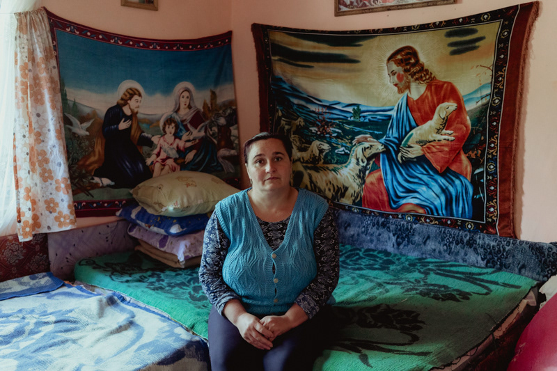 Ionela, 35. She has only been back home for three days, after having completed her third consecutive year of working in England. Aside from a few final details, their home is almost done. Varvor village, Dolj county.