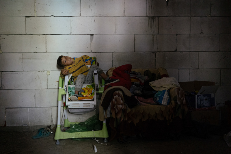 One of Irina's children, in an improvised storage room. Pietrisu village, Giurgiu county.