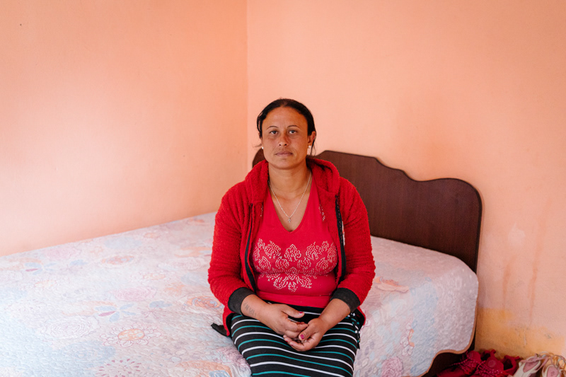 Elvira, 35, in her bedroom. Ocolna village, Dolj county.