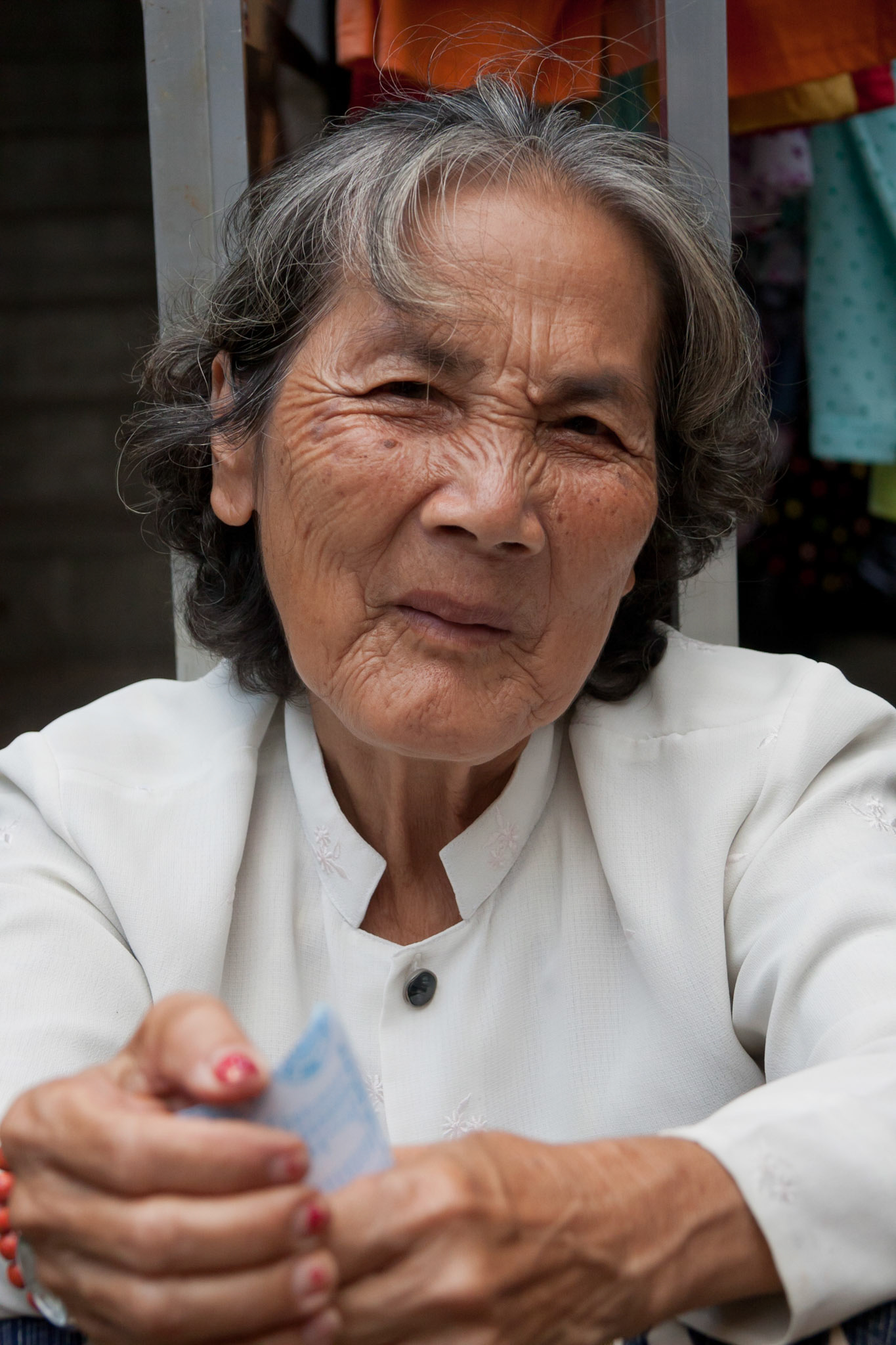 She sells vegatables on a small market in Ho Chi Minh City (Saigon)