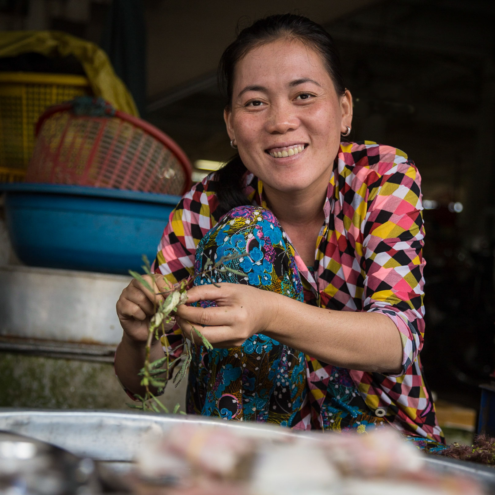 Fish seller on Bến Tre market, Mekong Delta, Vietnam