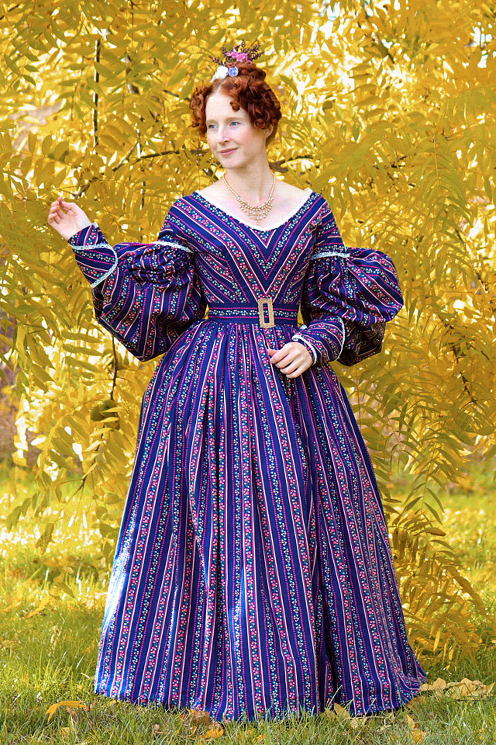 1830s cotton gown with puffed gigot sleeves. It is worn over a corded and flounced petticoat. Enquire for Bespoke Fitted pricing.