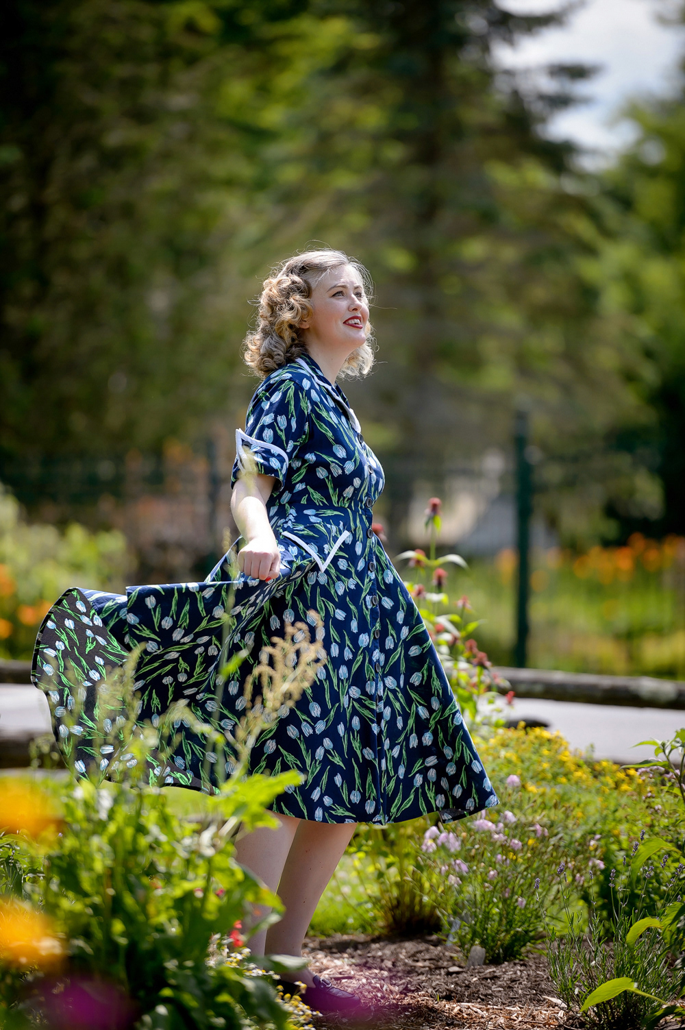 1950s House Dress: Extra interest is given to this cotton dress with added white trim on the pockets, collar & cuffs.