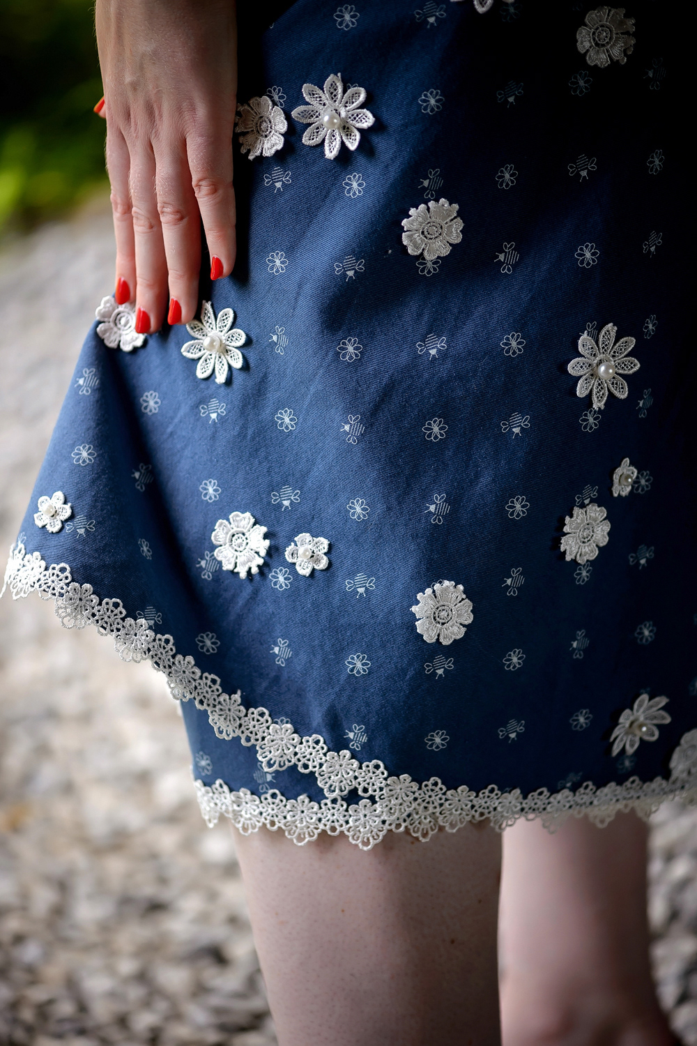 Early 1950s Bee Dress: This playful cotton twill day dress is brought to life with careful hand-stitched lace appliqué detailing on the skirt.