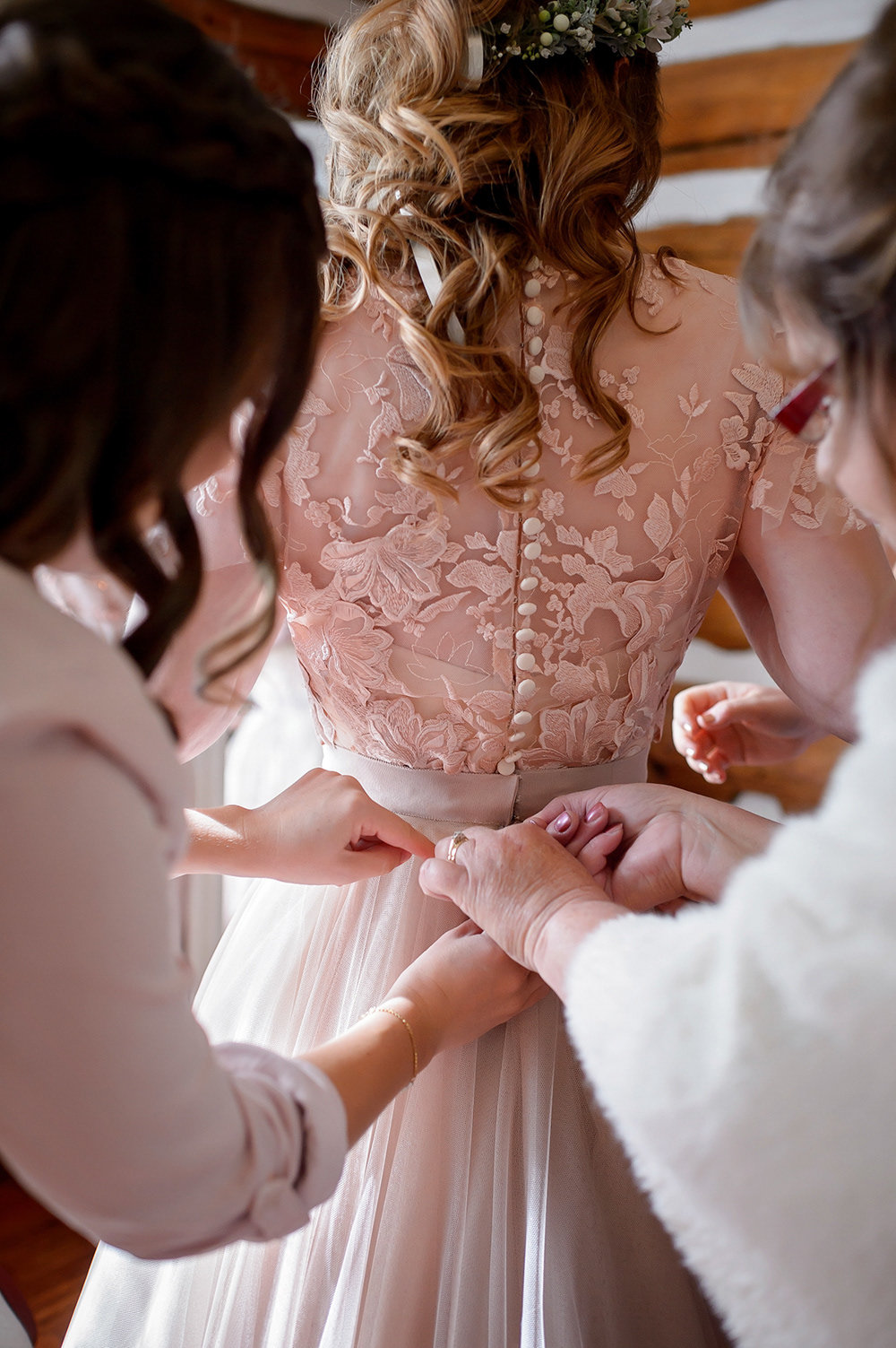 A custom bridal bodice featuring a romantic lace net overlay, and a structured silk under-bodice. Appliqué details are carefully individually hand sewn to cover dart and create a seamless couture finish.
