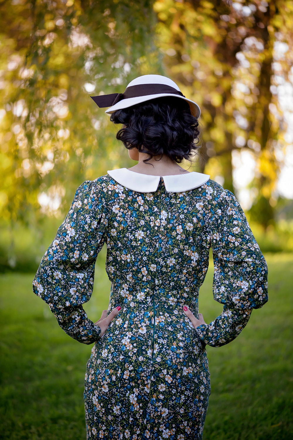 1930s Green Floral Dress: This dress is cut on the bias to fit the form and keep to the iconic look of the 1930s. Extra interest is given with a collar and handmade bow detail. Enquire for Bespoke Fitted pricing for bias-cut styles.