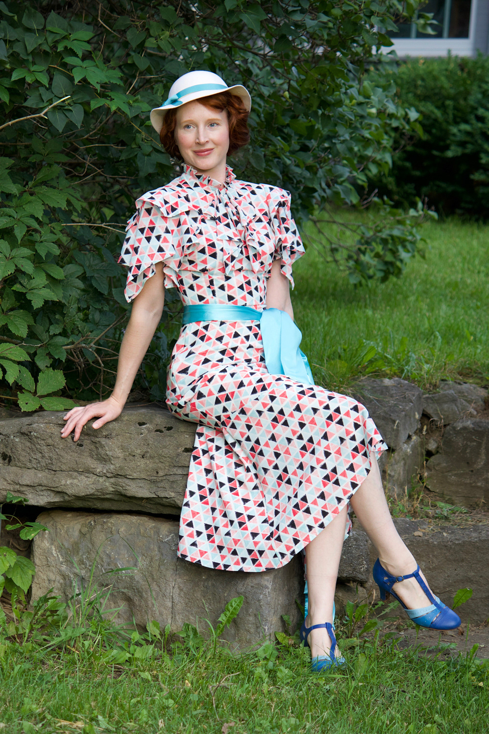 1930s Evening Gown: This elegant evening gown, inspired by the starlets of the 1930s, is cut on the bias with draped flowing sleeves and a light flowing skirt. Enquire for Bespoke Fitted pricing for bias-cut styles.