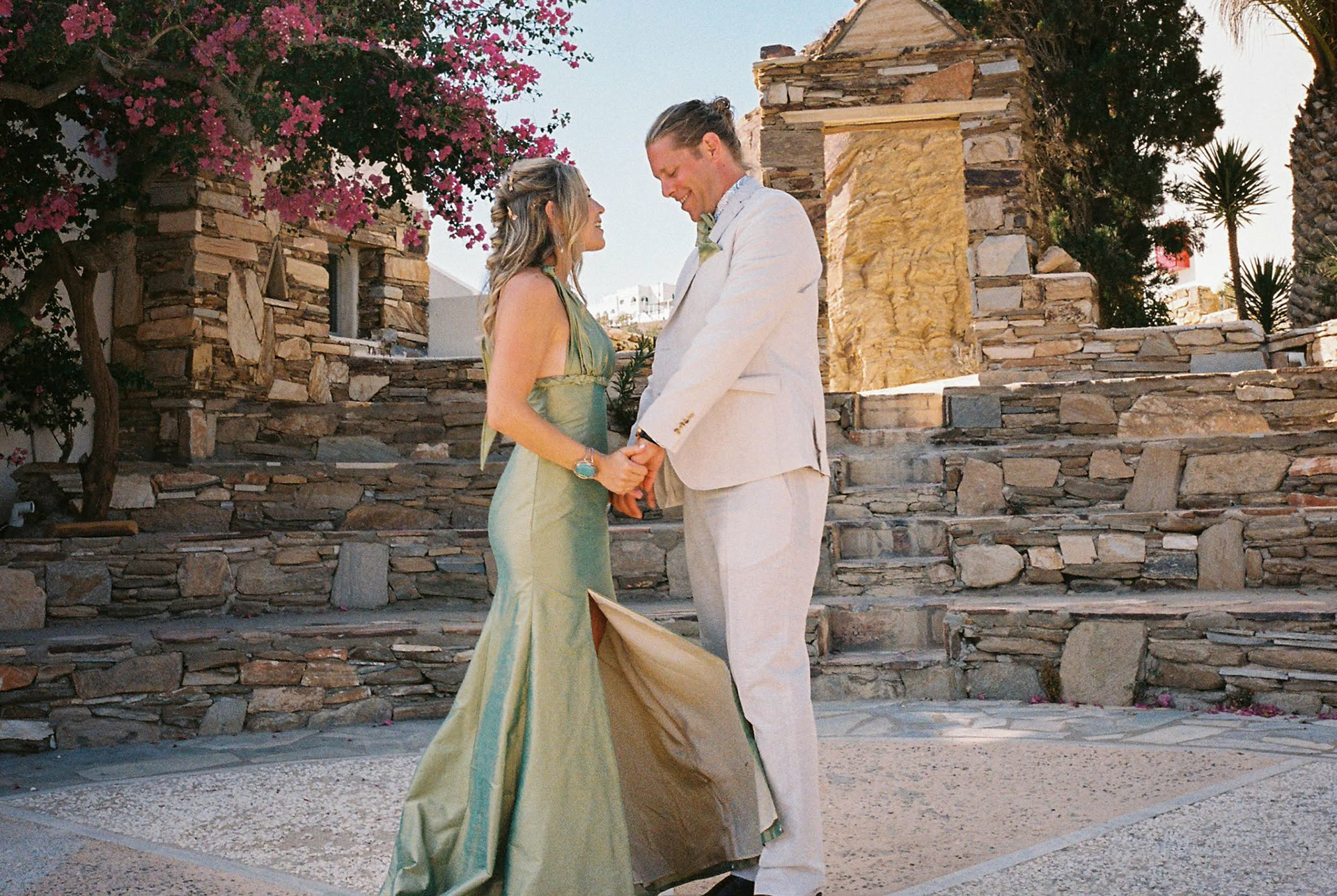 A grecian-inspired custom design for this bride getting married overseas. The dress is constructed from an iridescent silk taffeta woven in green and gold.