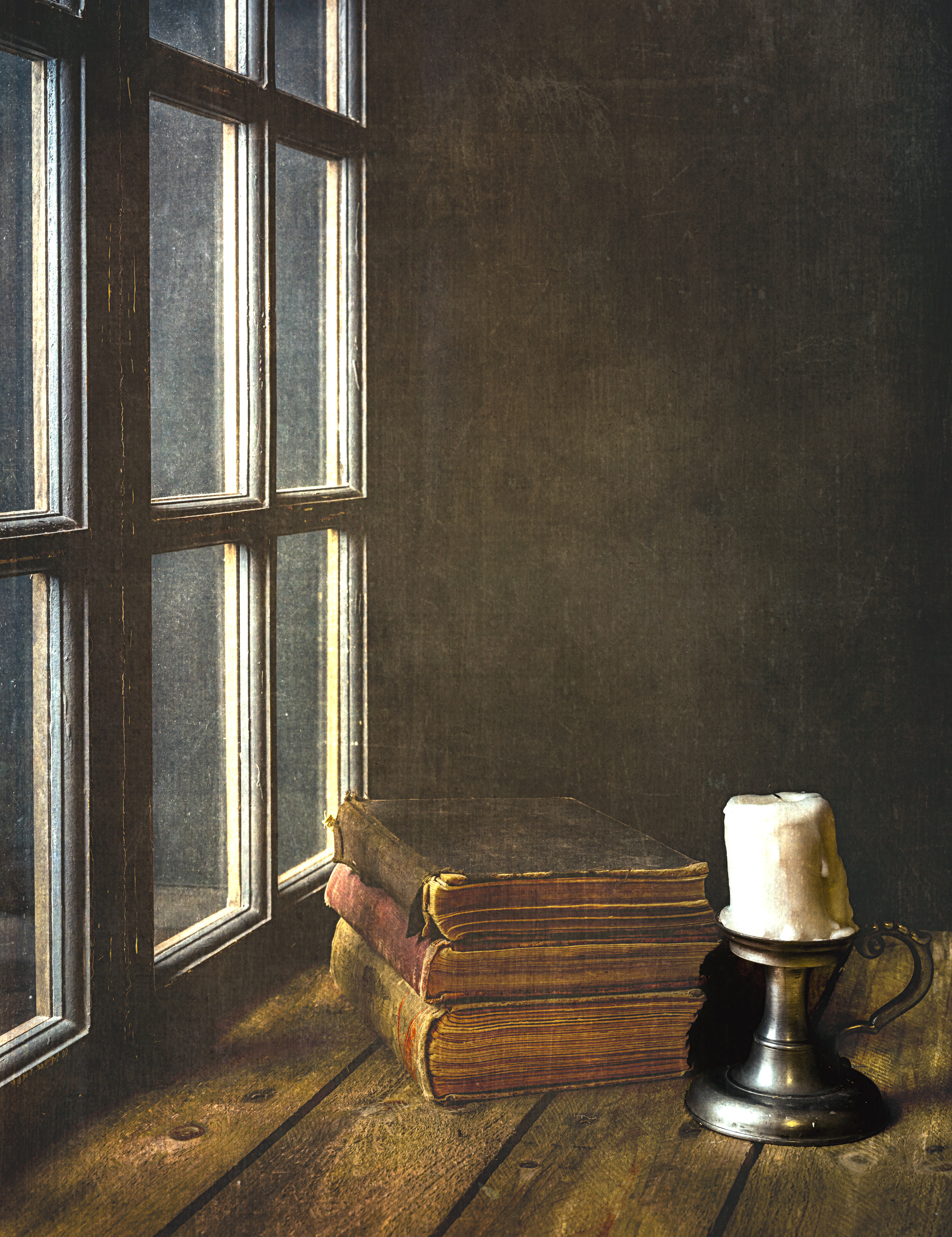 Books and Candle by the window