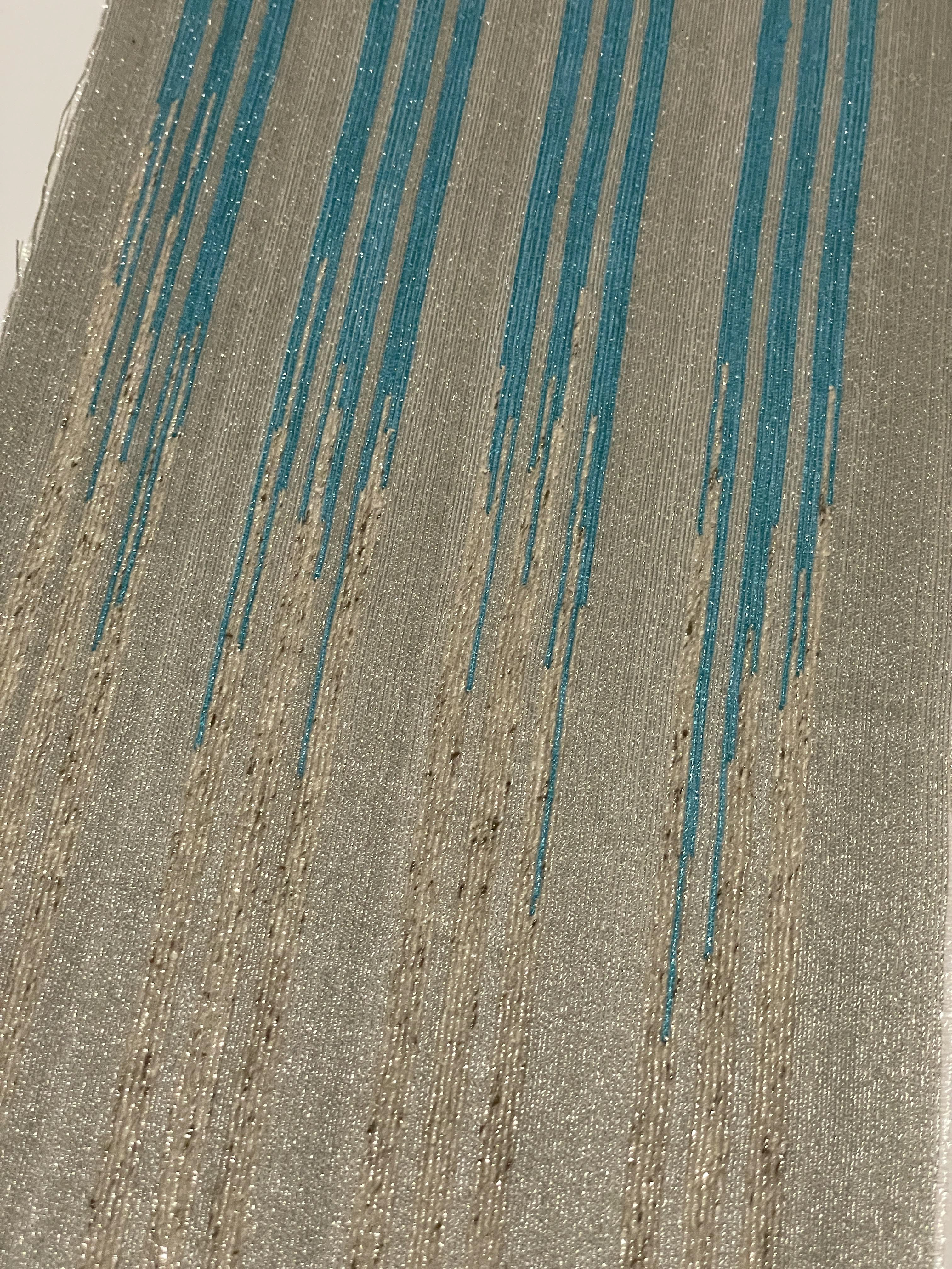 Slubbed cotton linked with blue dyed cotton creating ikat effect
