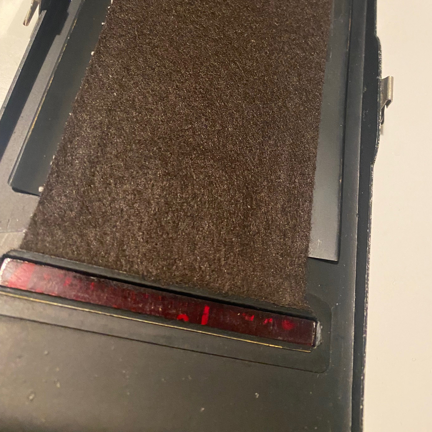 Vilt on the back and red transparant inlay 