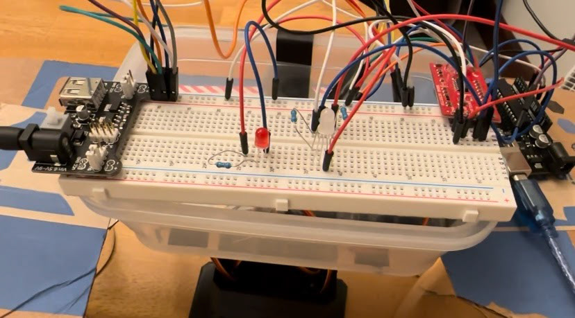 Breadboard setup for LED lights, servo motors, and Sparkfun sound detector