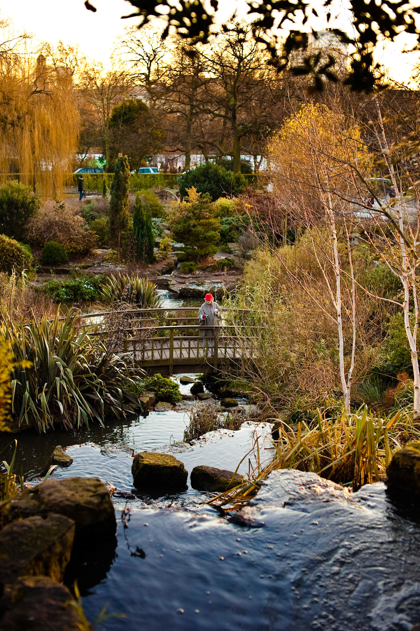 Lady in a red hat at Regents Park in London England.