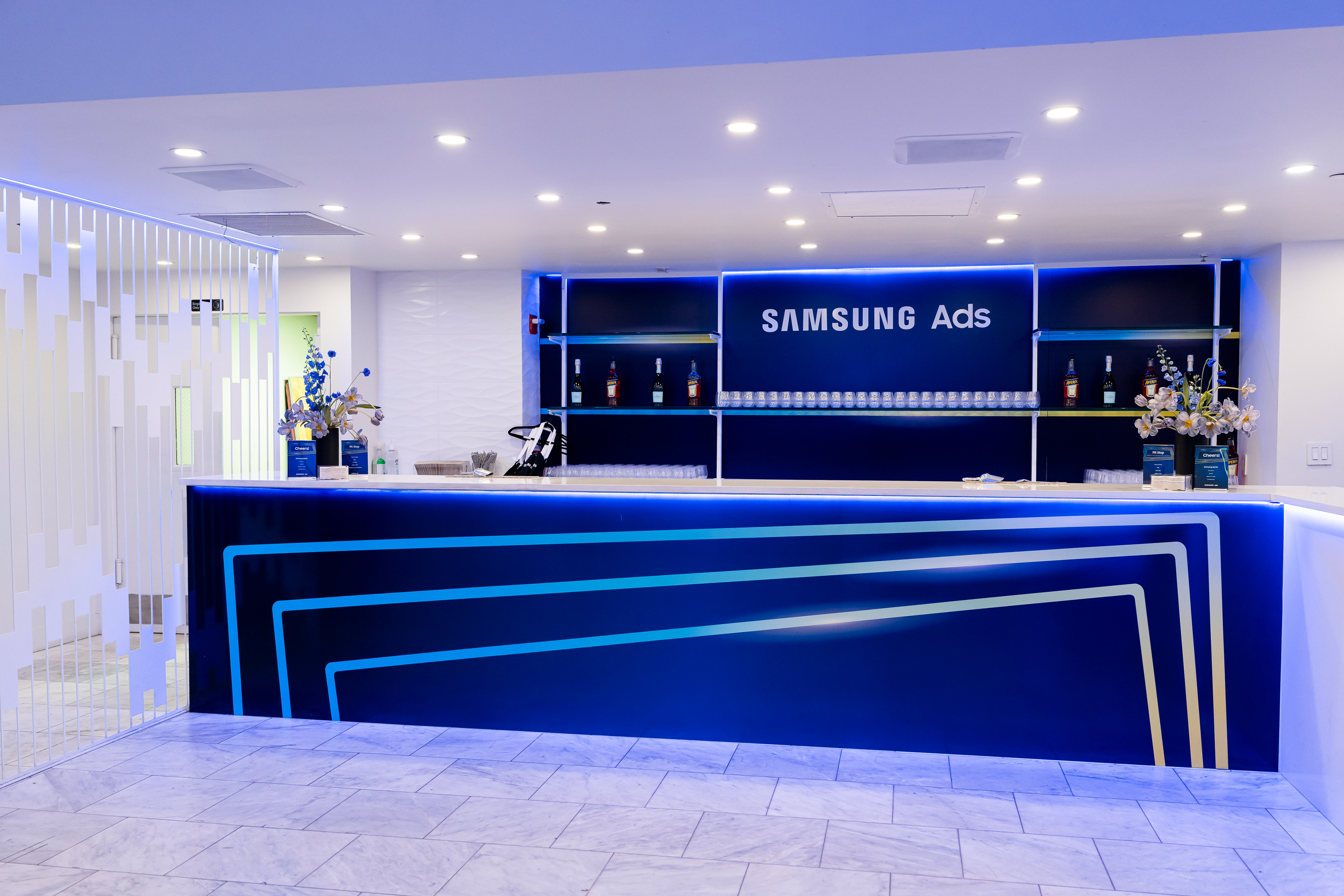 Interior reception bar area with Samsung Ads branded backlit counter