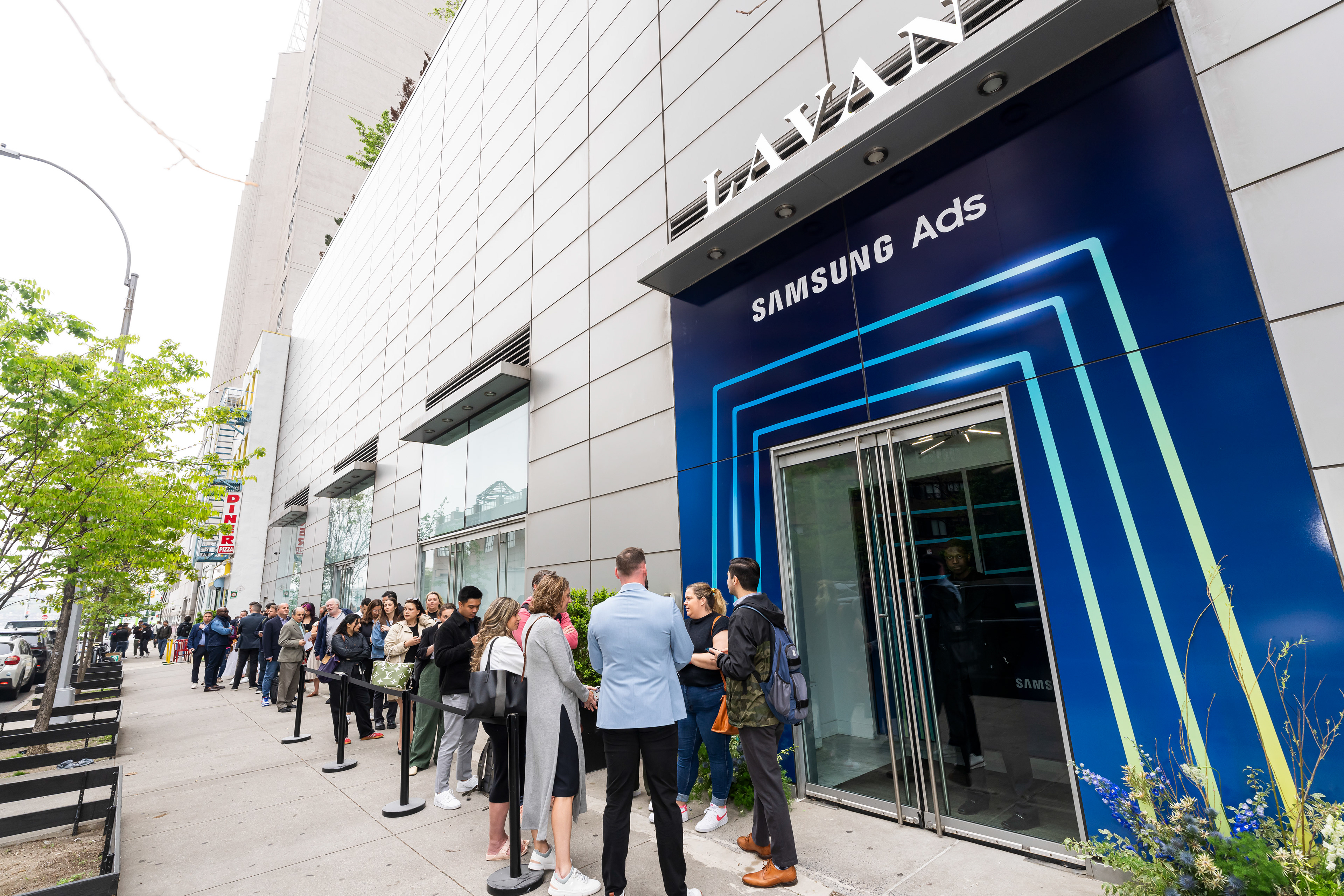 Exterior of the LAVAN venue with blue Samsung Ads neon signage