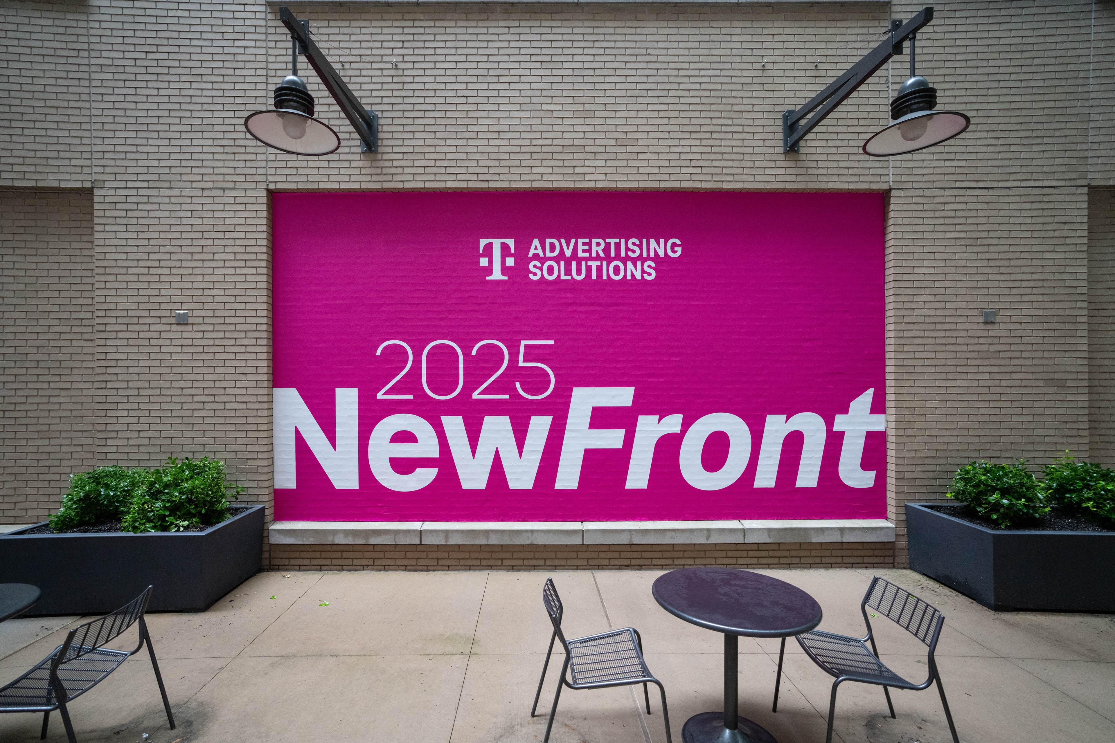 NewFront exterior building banner on brick facade