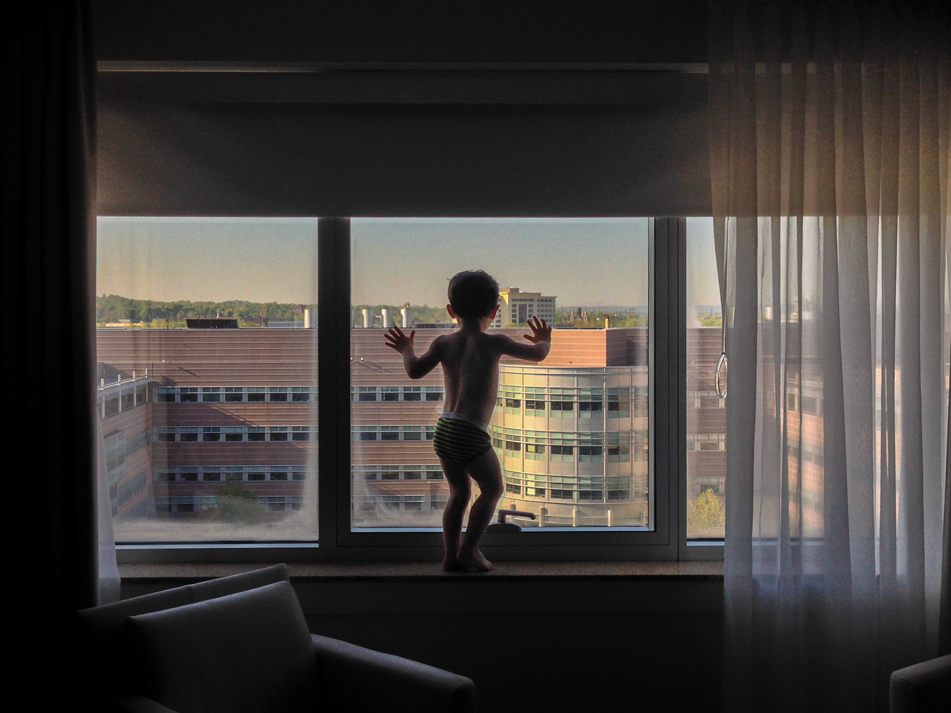 Christopher at a hotel window.