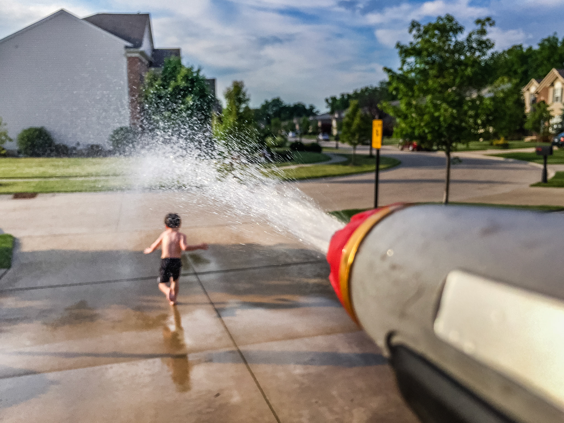 Christopher and water gun.