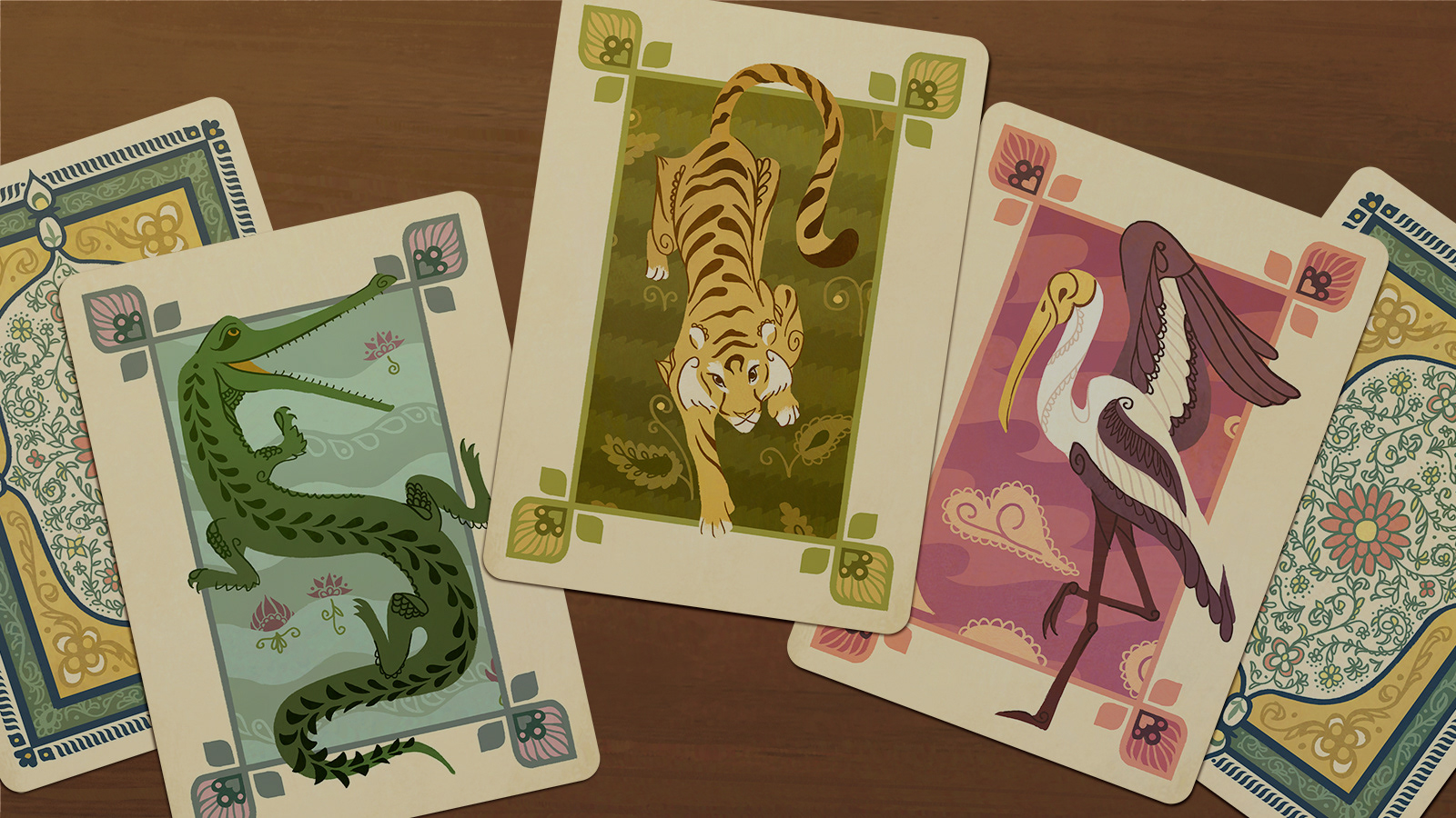 playing cards featuring a gharial, tiger, and ibis