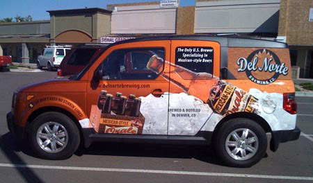 Orale on the left of the car - Vehicle Wrap