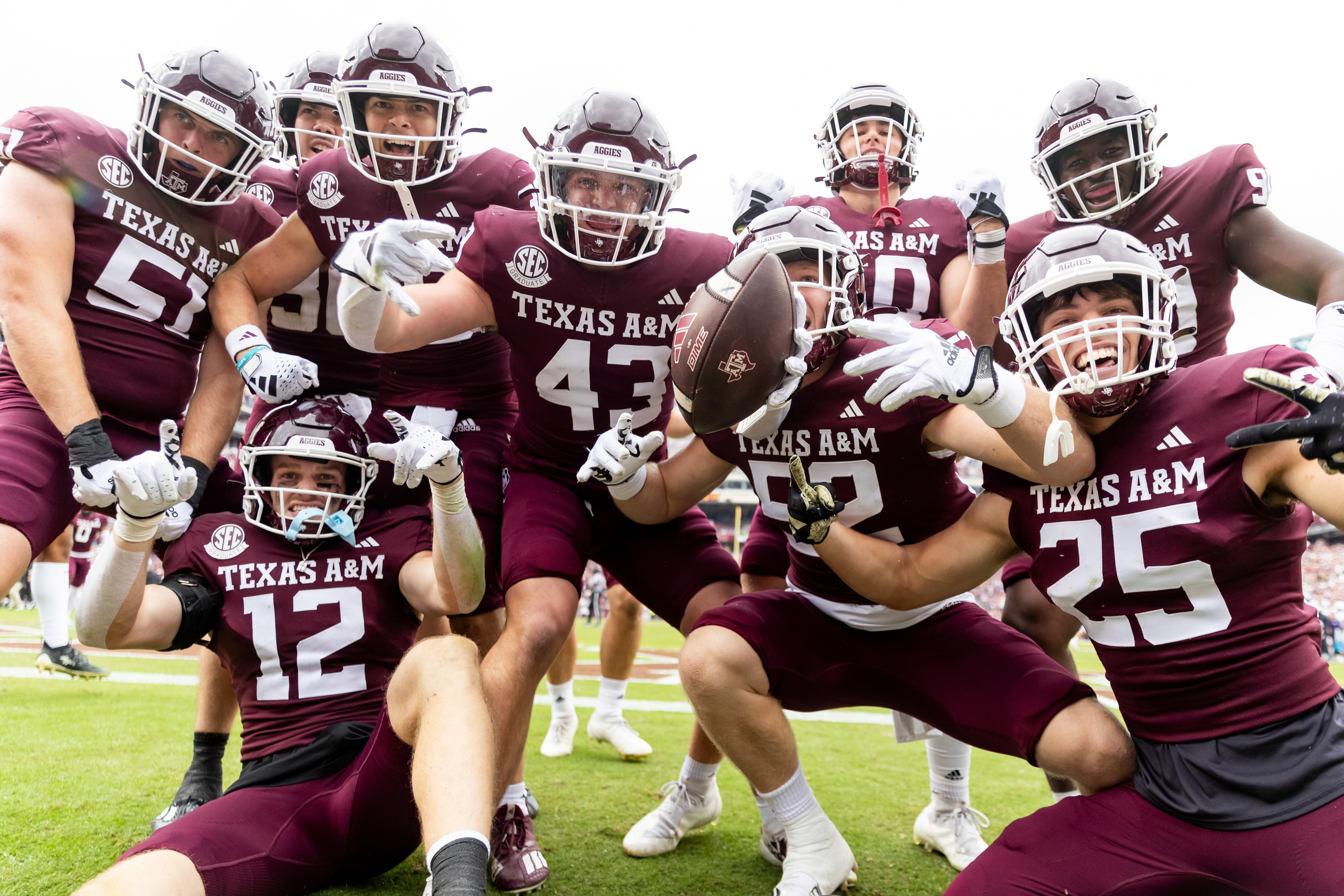 COLLEGE STATION, TX - November 18, 2023 - Players of the Texas A&M Aggies celebrate after forcing a turnover on a kickoff during a game against the Abilene Christian Wildcats at Kyle Field in College Station, TX. Photo By Aiden Shertzer/Texas A&M Athletics