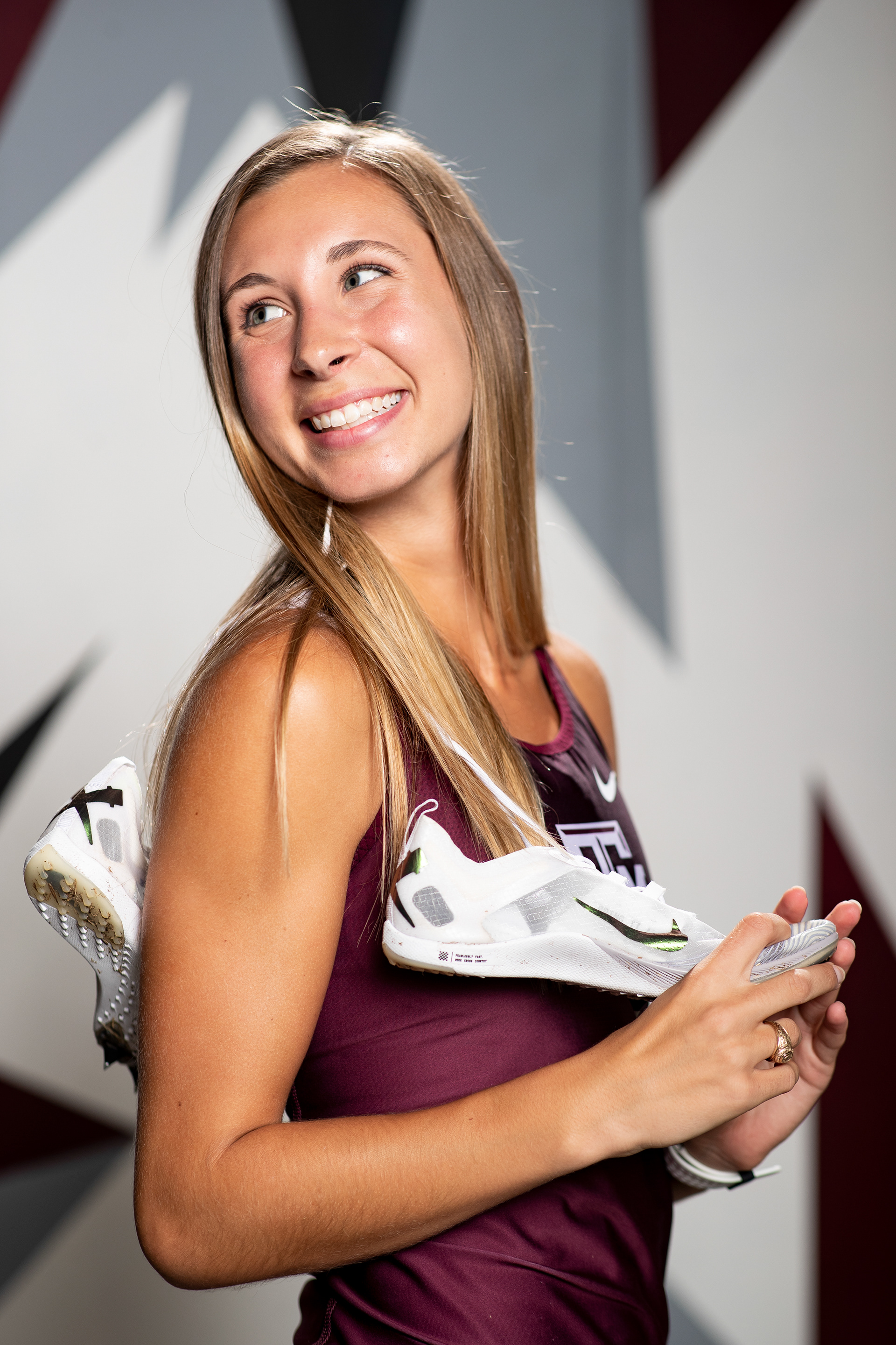 COLLEGE STATION, TX - August 18, 2022 - Grace Plain of the Texas A&M Aggies poses for a photo during Cross Country Photo Day at The Studio in Kyle Field in College Station, TX. Photo By Aiden Shertzer/Texas A&M Athletics