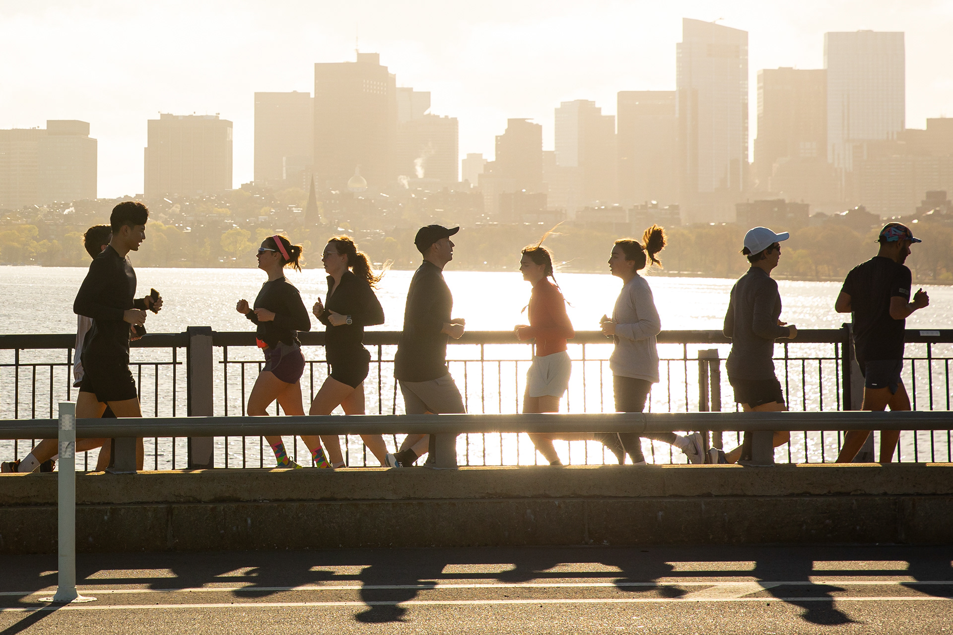 April 28, 2026, Boston, MA: Runners cross the Harvard Bridge as the sun rises over the Charles River, in Boston Massachusetts Tuesday, April 28, 2026. (Photo Credit Aiden Shertzer)
