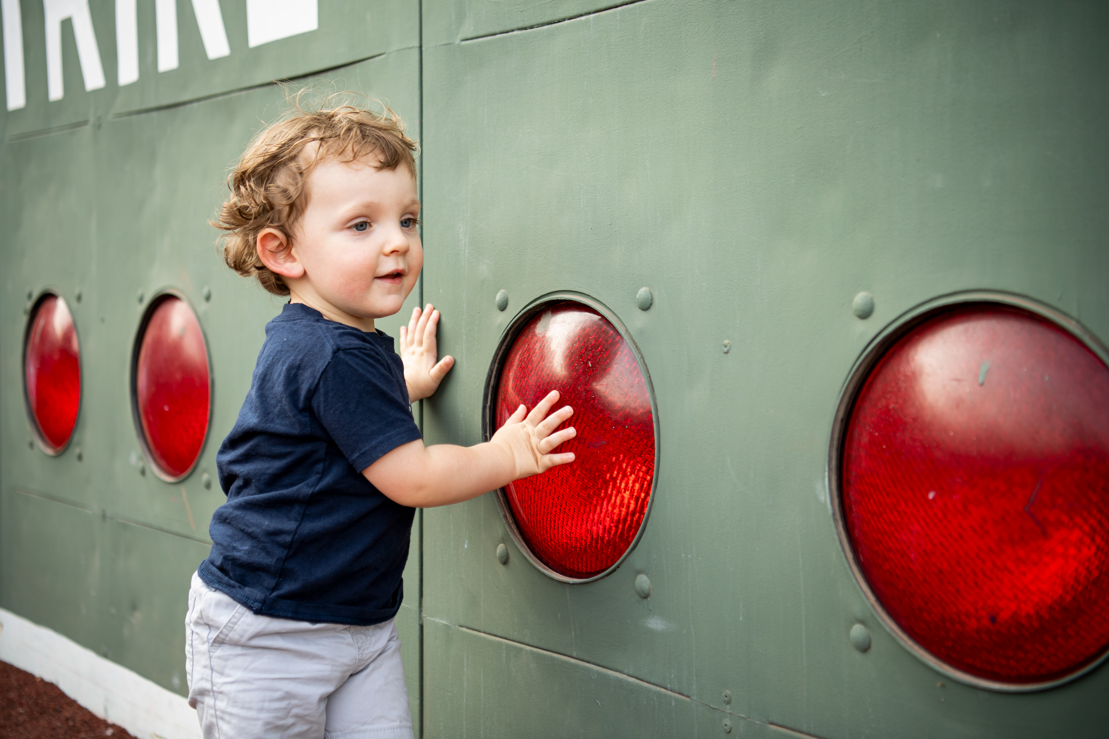 August 9, 2026, Boston, MA: A young fan walks along the Green Monster during Picnic in the Park after a game between the Athletics and the Boston Red Sox at Fenway Park in Boston, Massachusetts Sunday, August 9, 2026. (Photo by Aiden Shertzer/Boston Red Sox)