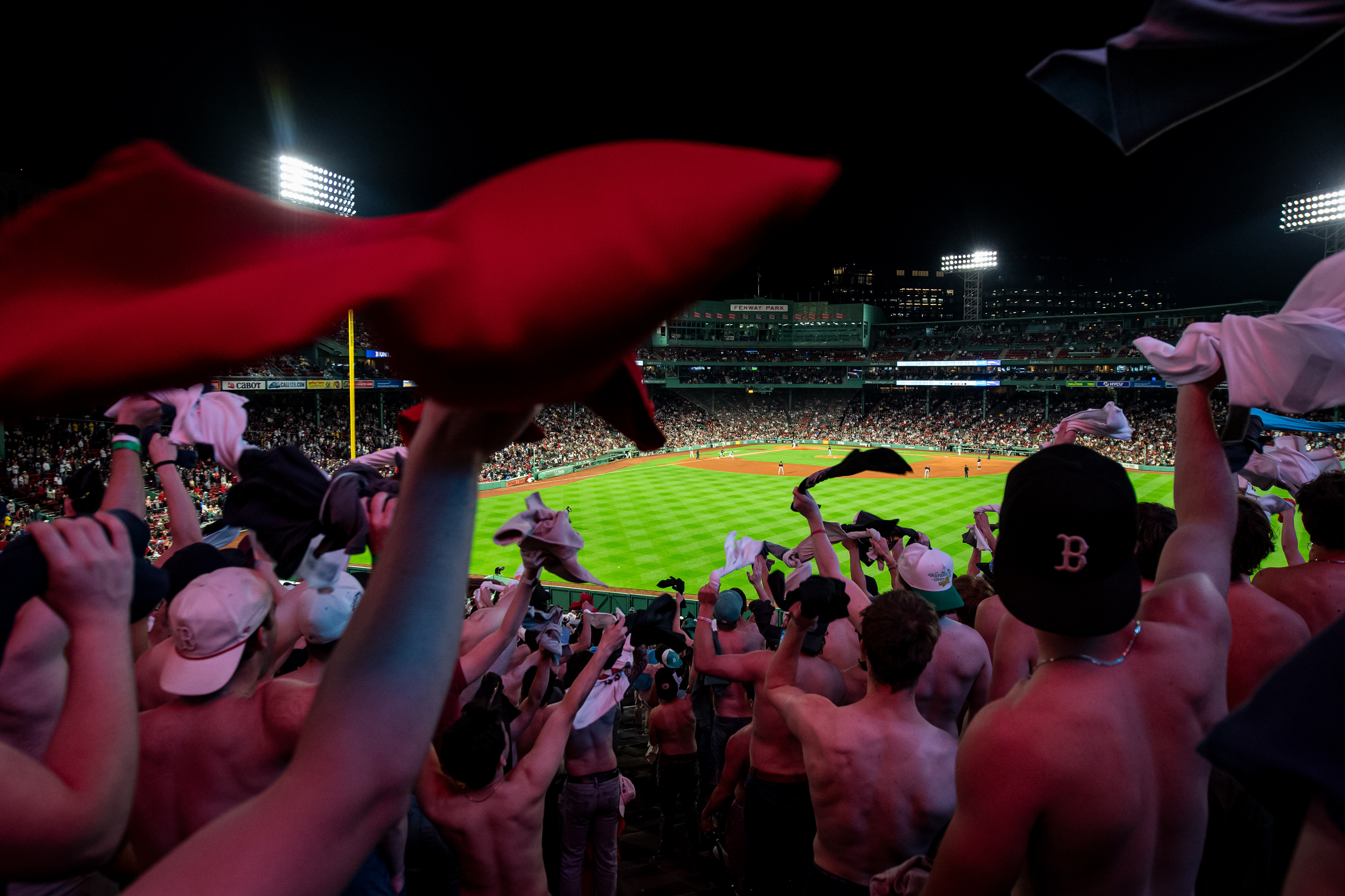 May 22, 2026, Boston, MA: Fans wave their shirts in the air during a game between the the Minnesota Twins and the Boston Red Sox at Fenway Park in Boston, Massachusetts Friday, May 22, 2026. (Photo by Aiden Shertzer/Boston Red Sox)