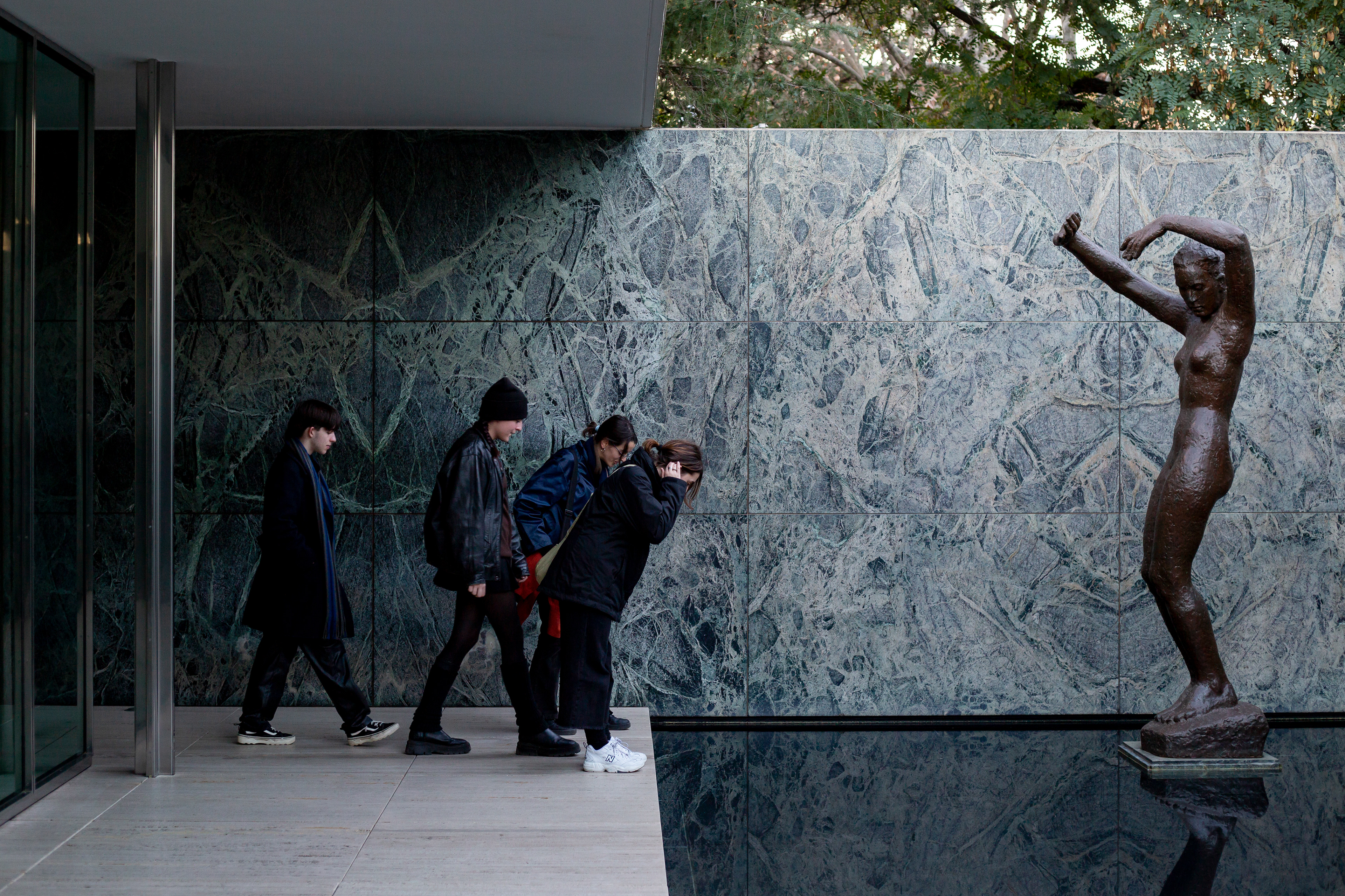 January 25, 2023, Barcelona, ESP: Students examine reflecting pool while on a field trip at the Mies van der Rohe Pavilion, in Barcelona,  Wednesday, January 25, 2023. (Photo by Aiden Shertzer)