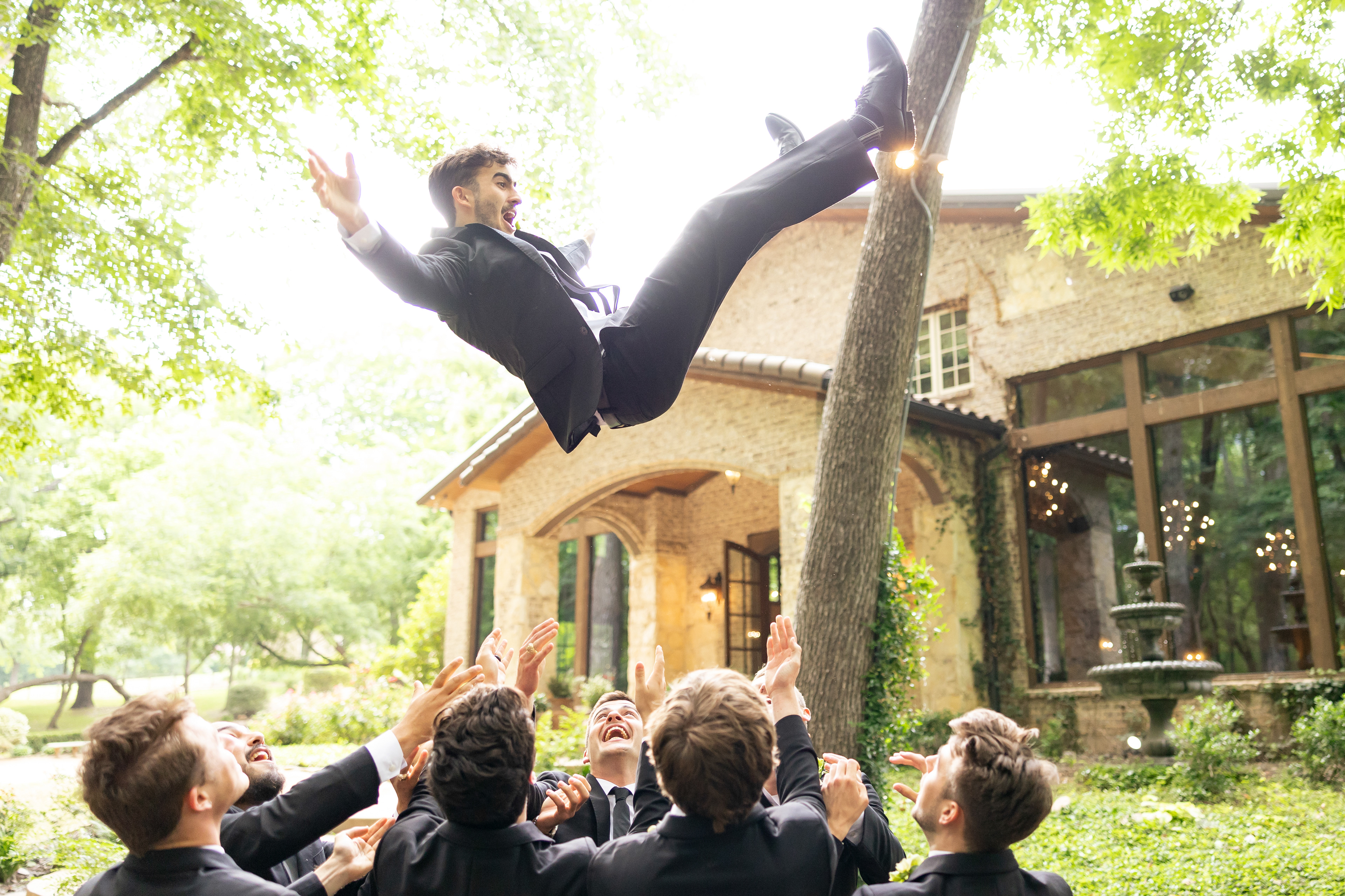 May 23, 2024, Waxahachie, TX: Groom Jake Taylor is tossed by his groomsmen during prior to his wedding at The Springs Waxahachie, in Waxahachie, Texas Thursday, May 23, 2024. (Photo by Aiden Shertzer)