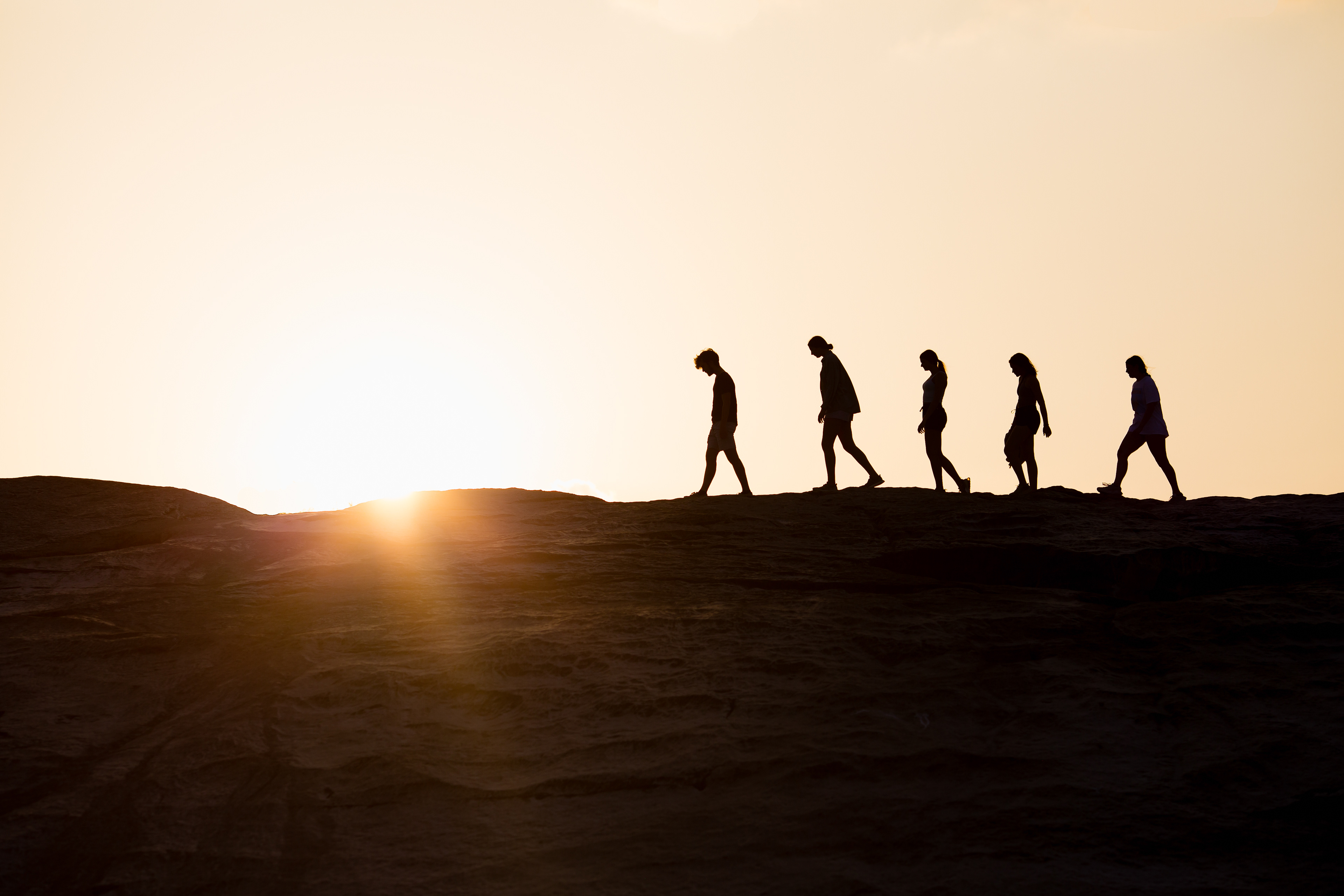 May 3, 2022, Johnson City, TX: Silhouettes of hikers crossing a ridge at Pedernales Falls State Park in Johnson City, Texas Tuesday, May 3, 2022. (Photo by Aiden Shertzer)