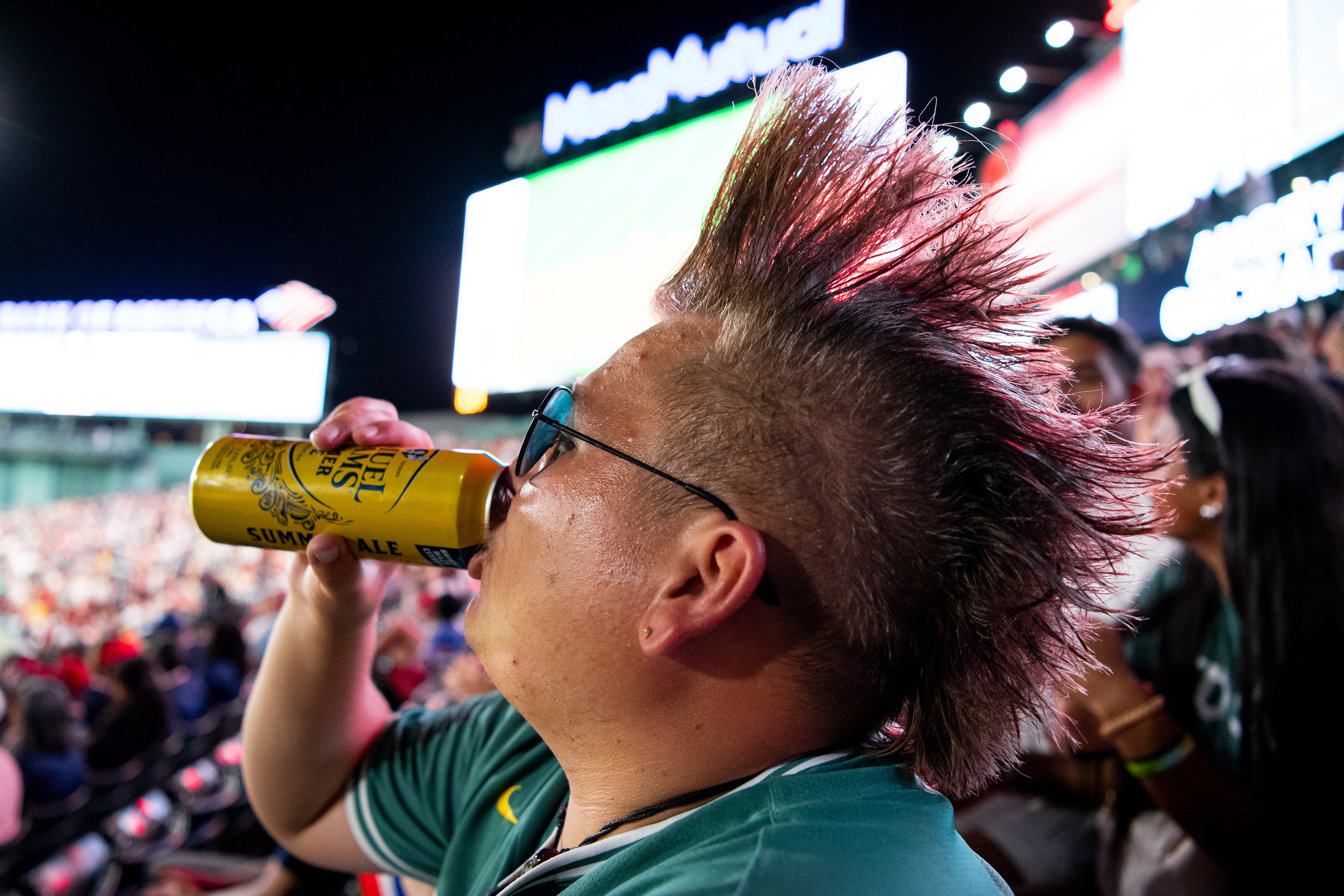 August 4, 2026, Boston, MA: A fan with a mohawk sips beer during a game between the Chicago White Sox and the Boston Red Sox at Fenway Park in Boston, Massachusetts Tuesday, August 4, 2026. (Photo by Aiden Shertzer/Boston Red Sox)