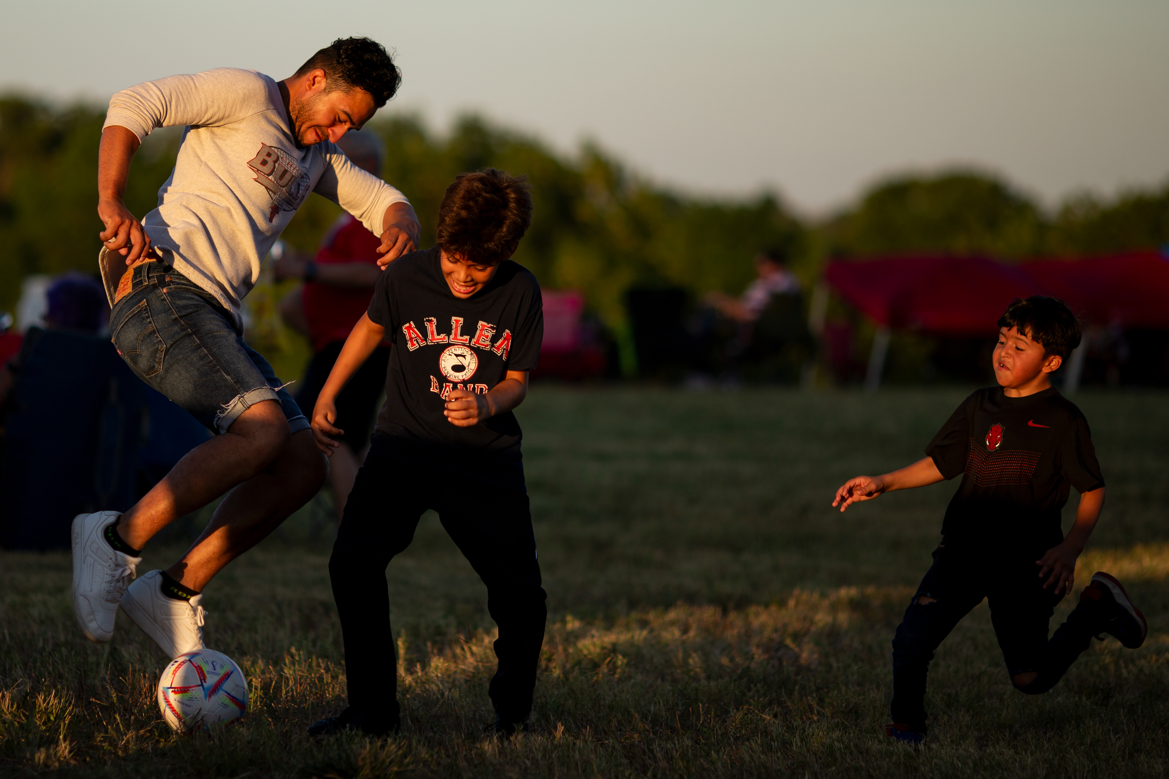 July 4, 2022, Plano, TX: Brothers play soccer in a field prior to the fireworks show during Plano’s All American 4th celebration at Collin College, in Plano, Texas Monday, July 4, 2022. (Photo by Aiden Shertzer)