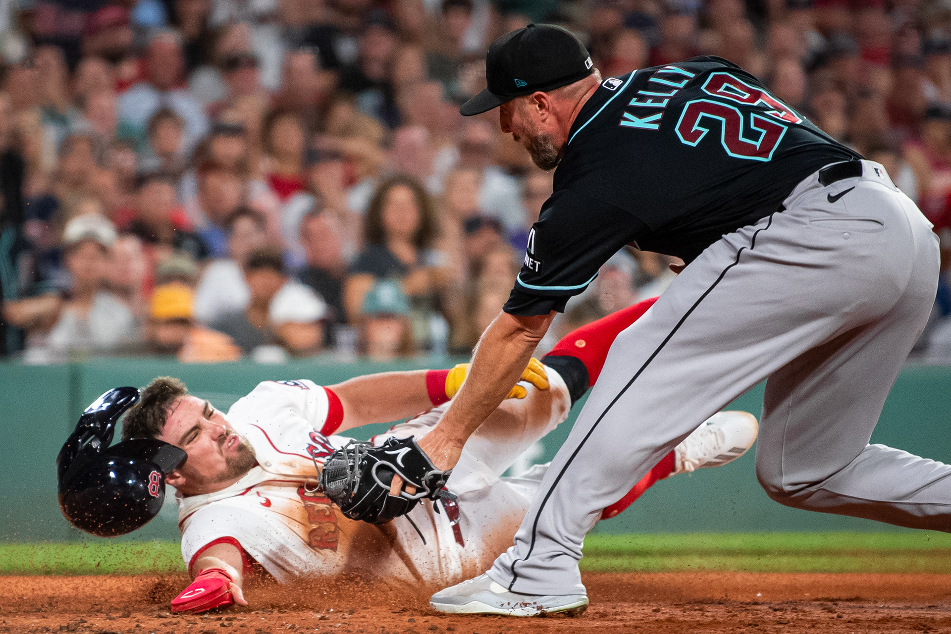 August 18, 2026, Boston, MA: Caleb Durbin #5 of the Boston Red Sox slides into home plate on a wild pitch to score during the third inning of a game against the Arizona Diamondbacks at Fenway Park in Boston, Massachusetts Tuesday, August 18, 2026. (Photo by Aiden Shertzer/Boston Red Sox)