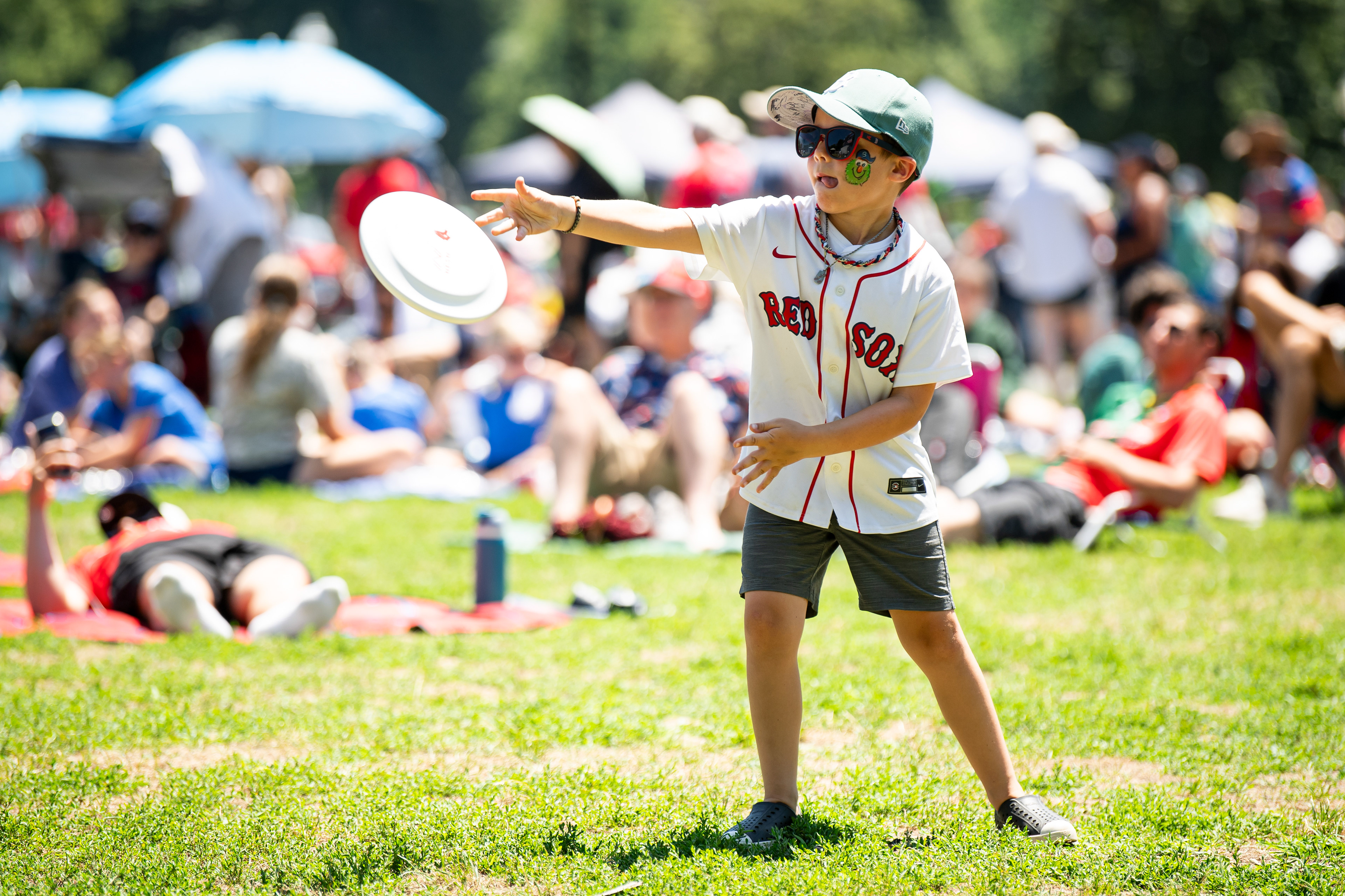 July 12, 2026, Boston, MA: A fan throws a frisbee during Out of the Park at the Boston Common in Boston, Massachusetts Sunday, July 12, 2026. (Photo by Aiden Shertzer/Boston Red Sox)