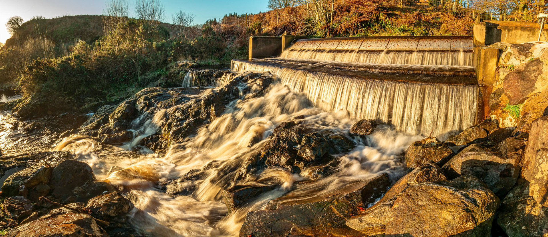 Maich water on the North Aryshire Renfrewshire border flows over a weir.