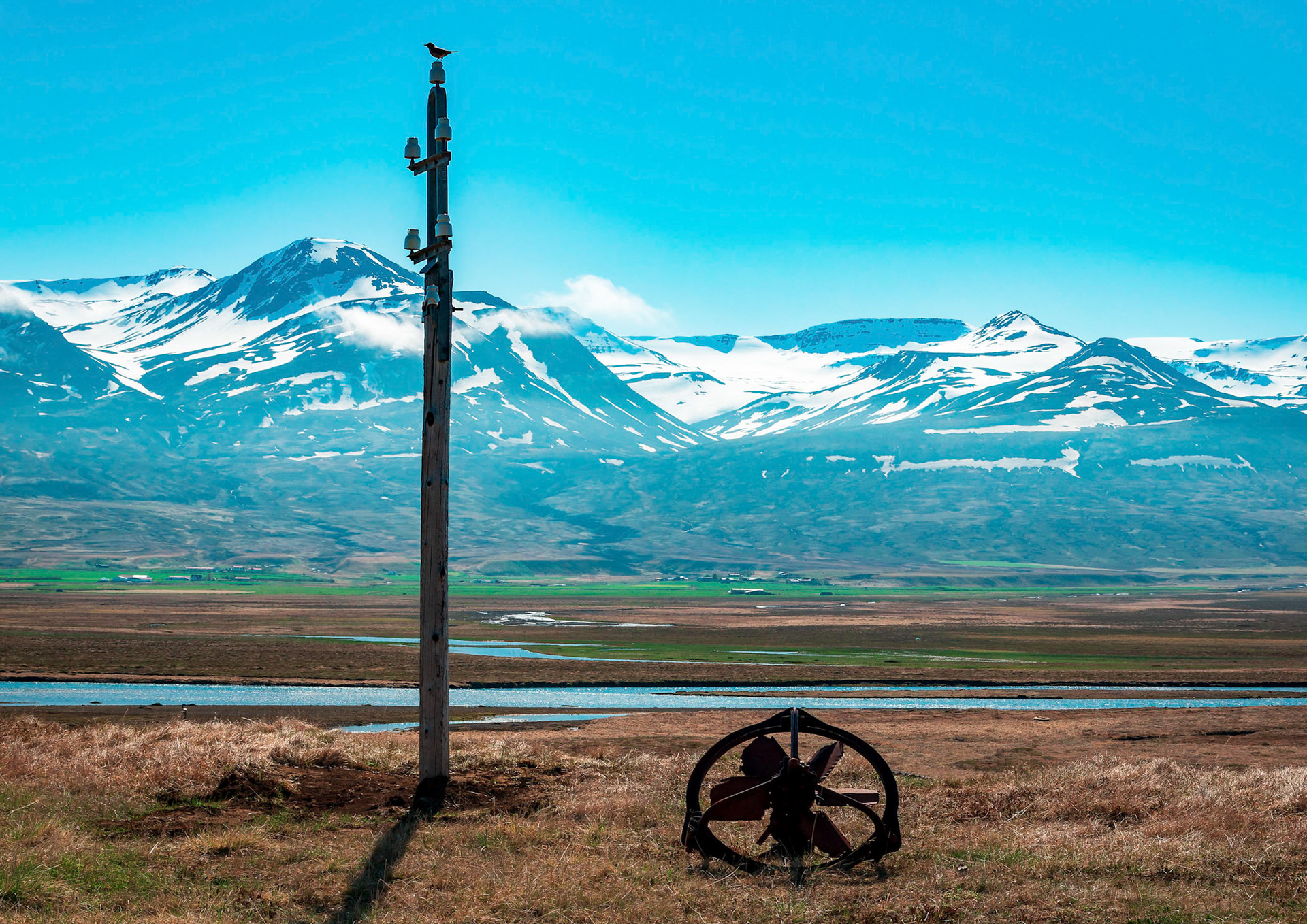An old telegraph pole stands witness over Smjörfjöll mountain region.