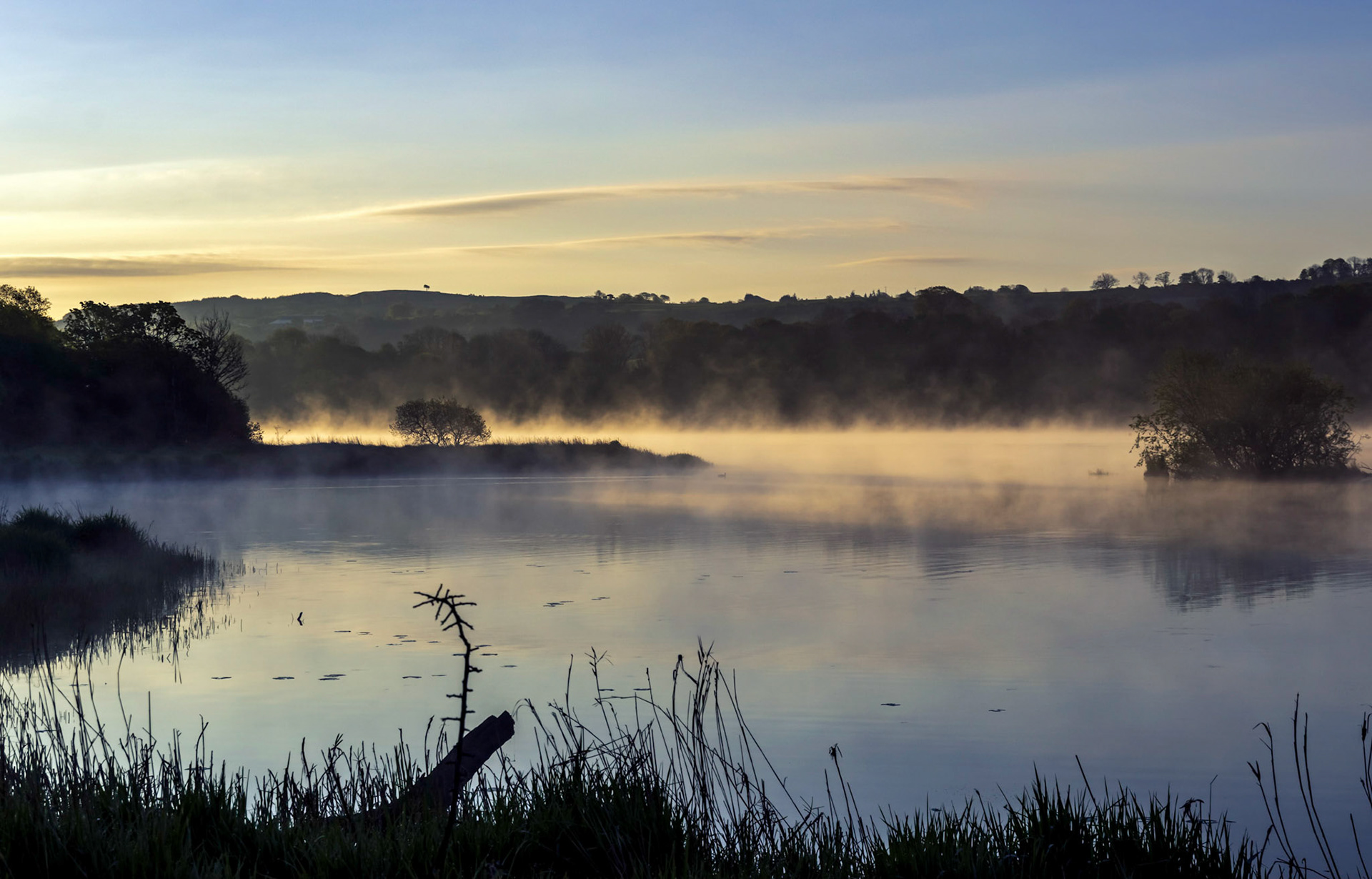 On an early morning walk the sunrise light cretead mist from the Castle Semple Loch (Lake).