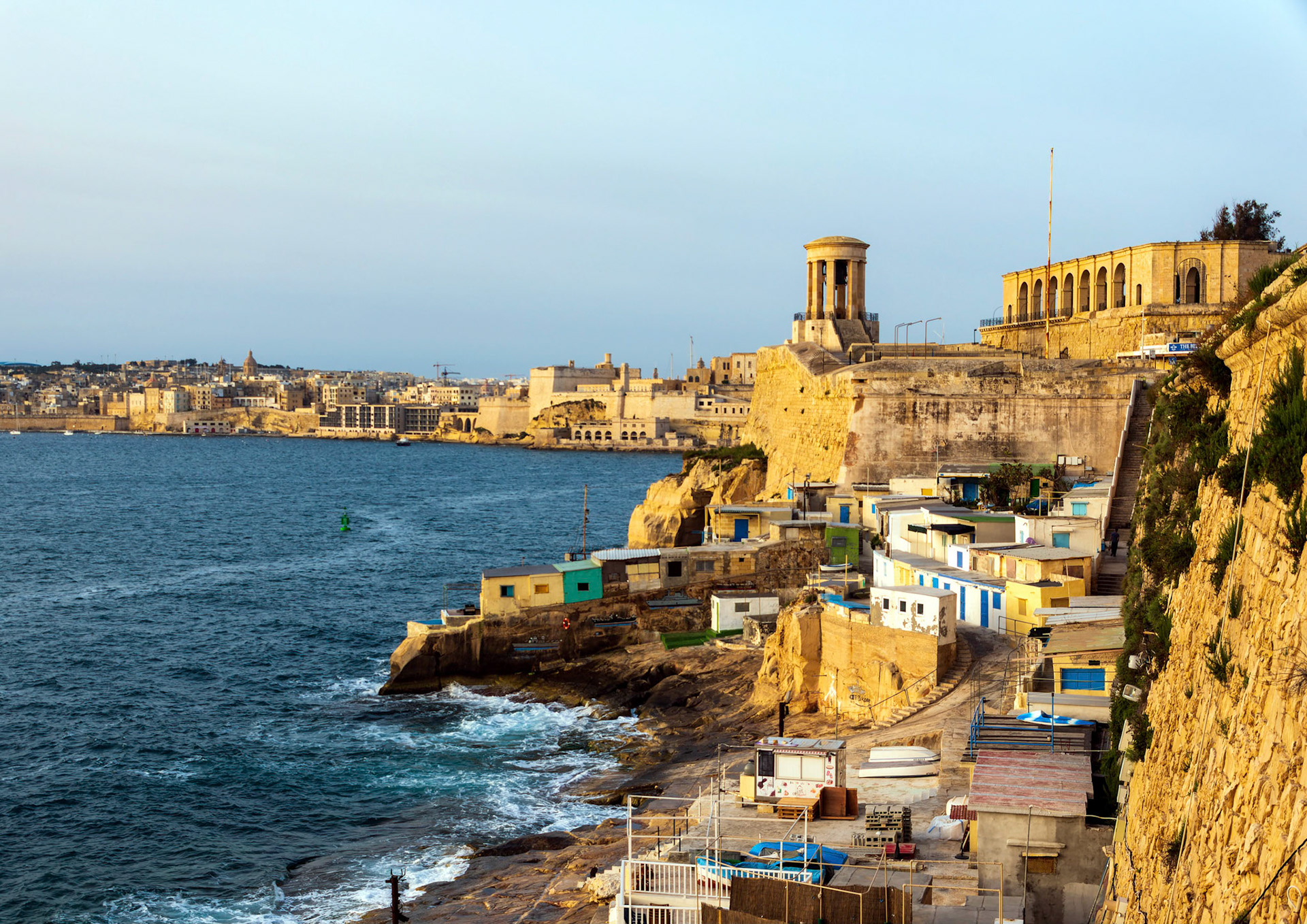 A warming sunrise,  Siege Bell War Memorial, Grand Harbour, Valletta, Malta.
