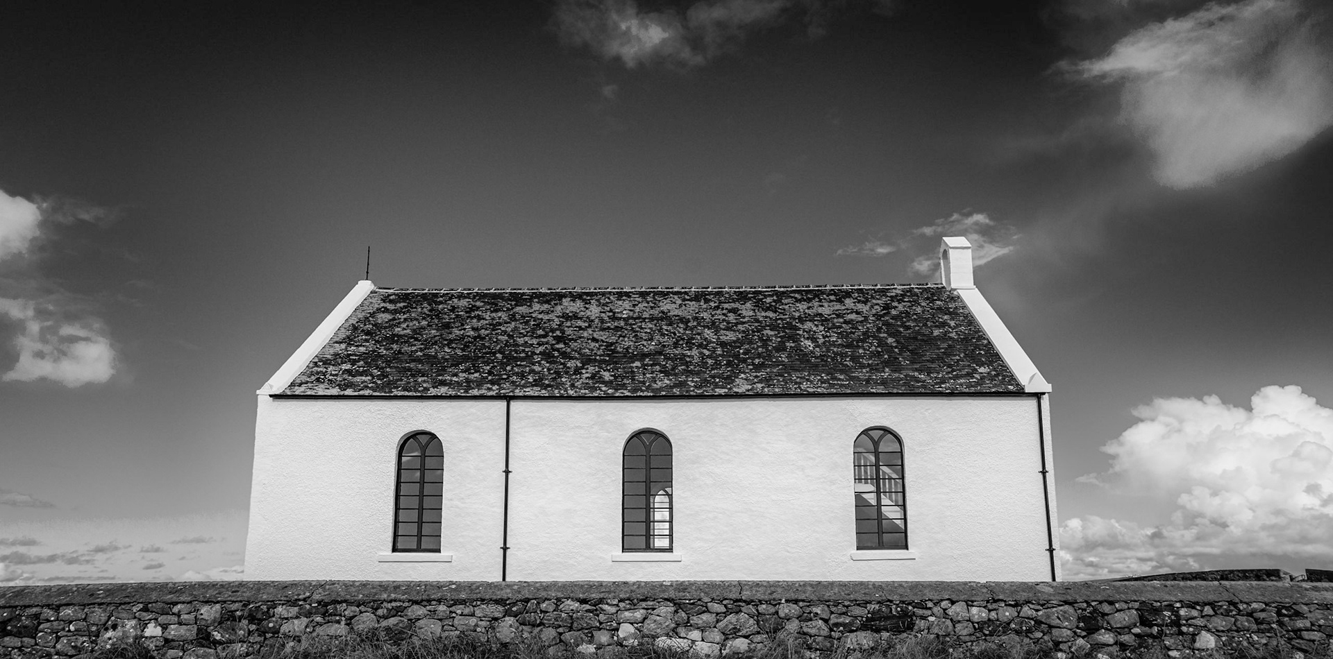 On the Outer Hebridean island of South Uist sits Howmore Church, the bright white church stands out so much that it is used by fishing boats as a landmark.