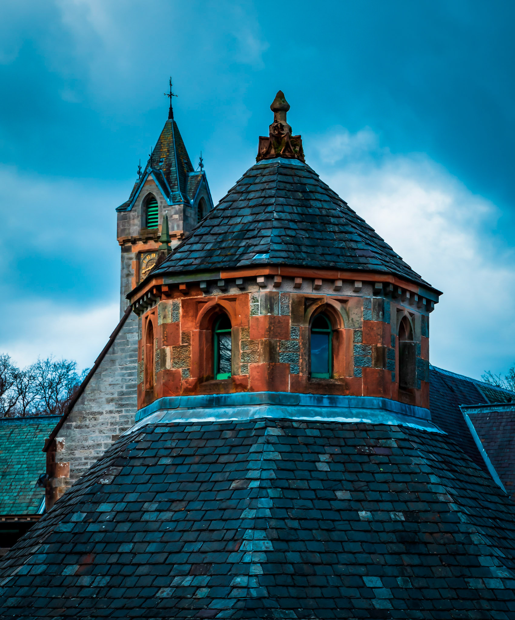 The roofs of a piggery (Foreground) and stables (Background).