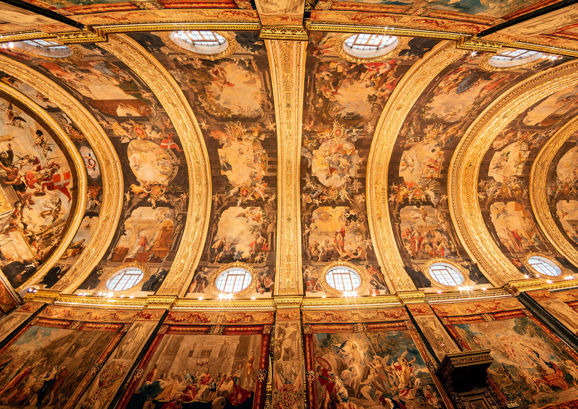 The Barrel vault ceiling of the Nave, Saint John's Co-Cathedral, Valletta, Malta is painted with scences from the life of John the Baptist.