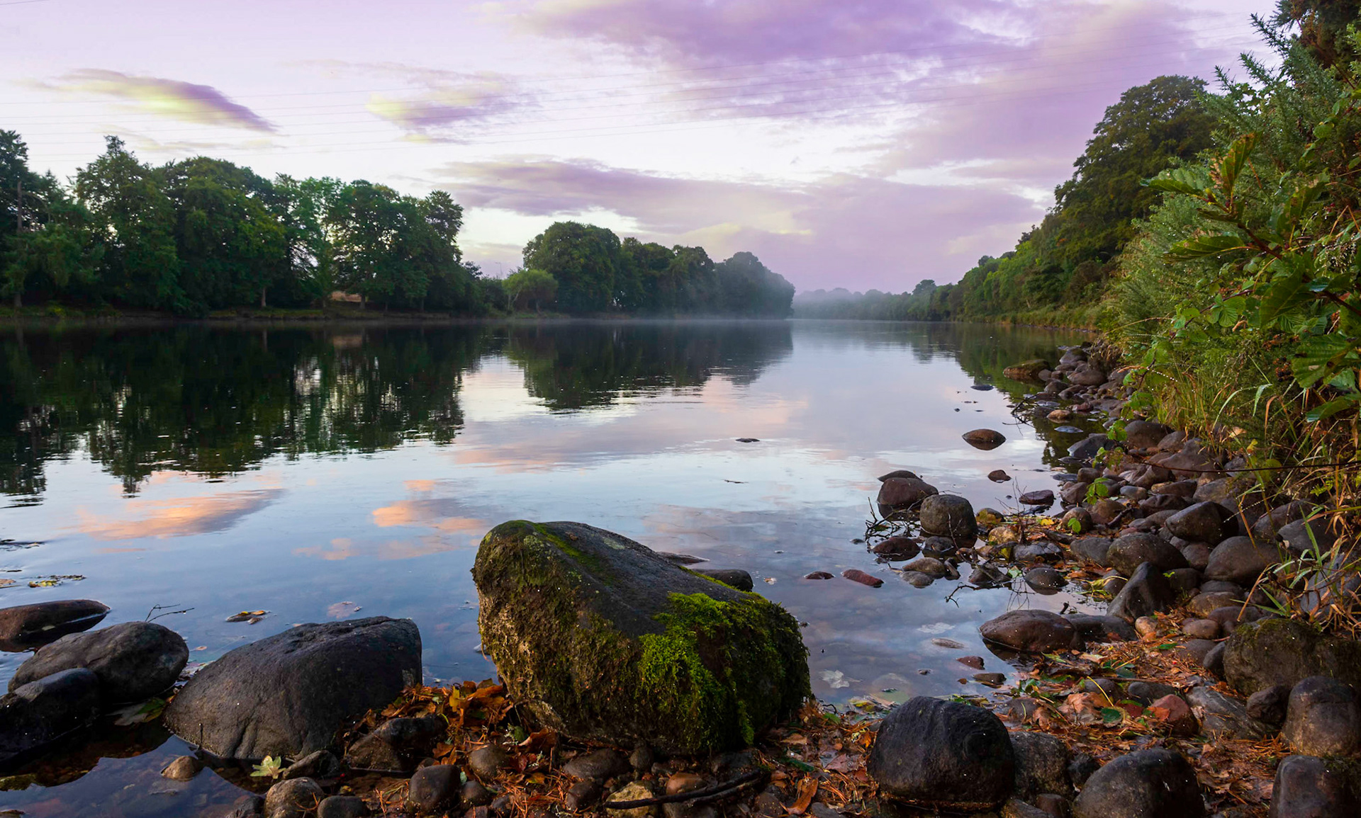Morning light and some mist hangs over the River Ness near Inverness in the Highlands of Scotland.