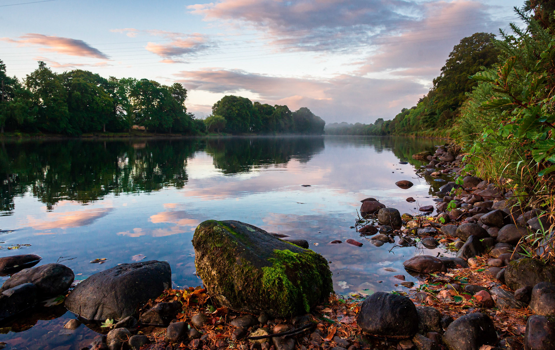 Morning light and some mist hangs over the River Ness near Inverness in the Highlands of Scotland.