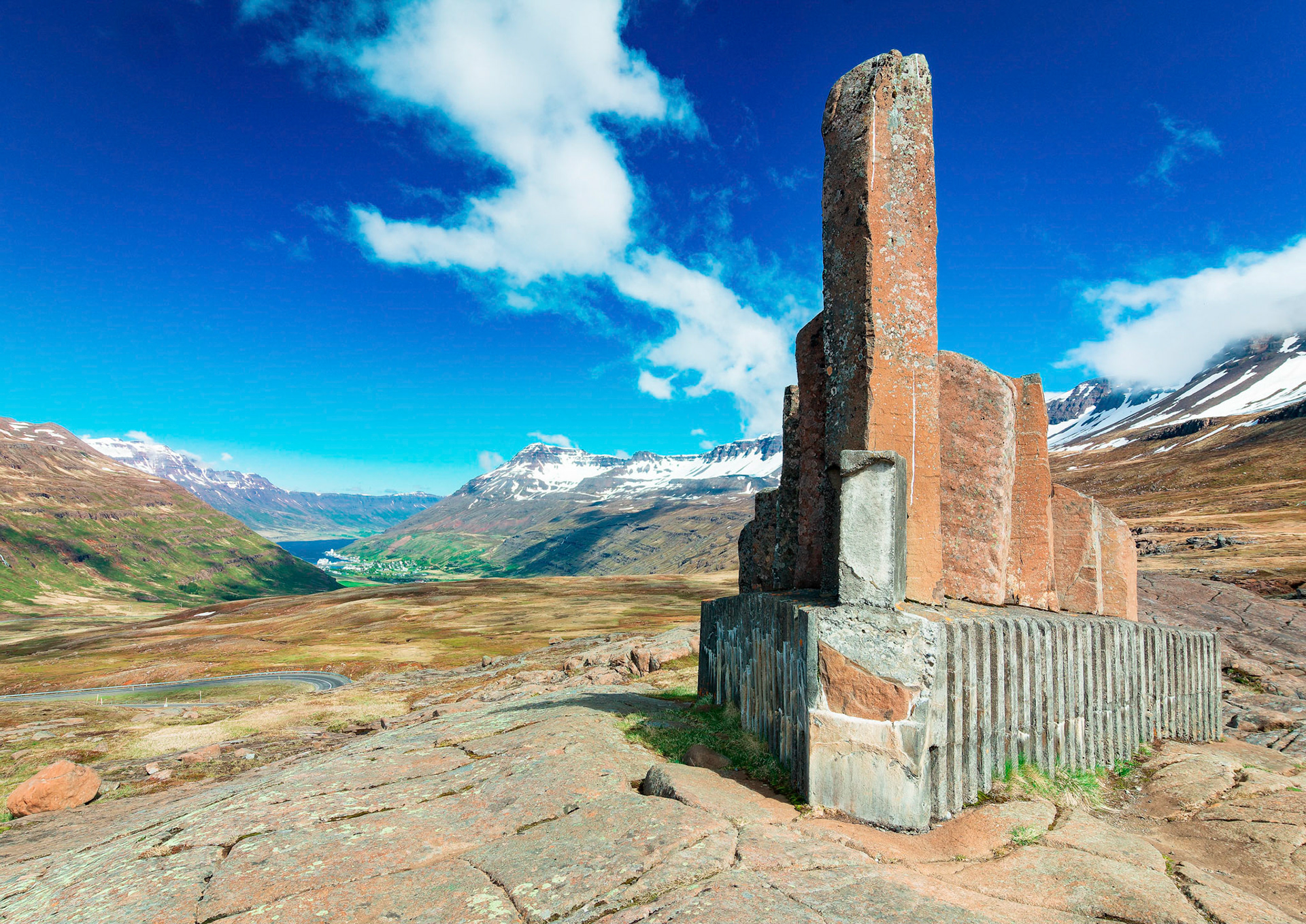 This memorial was erected to remember Þorbjörn Arnoddsson by the people of Seyðisfjörður. Þorbjörn Arnoddsson was a pioneer of winter travel over Fjarðarheiði mountain pass near the town of Seyðisfjörður.