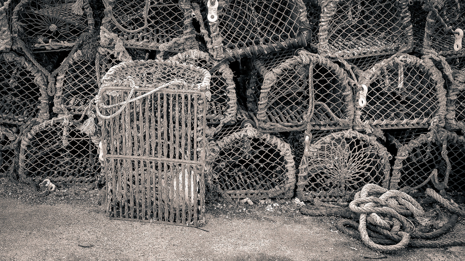 Traps stacked up on on a harbor quay.